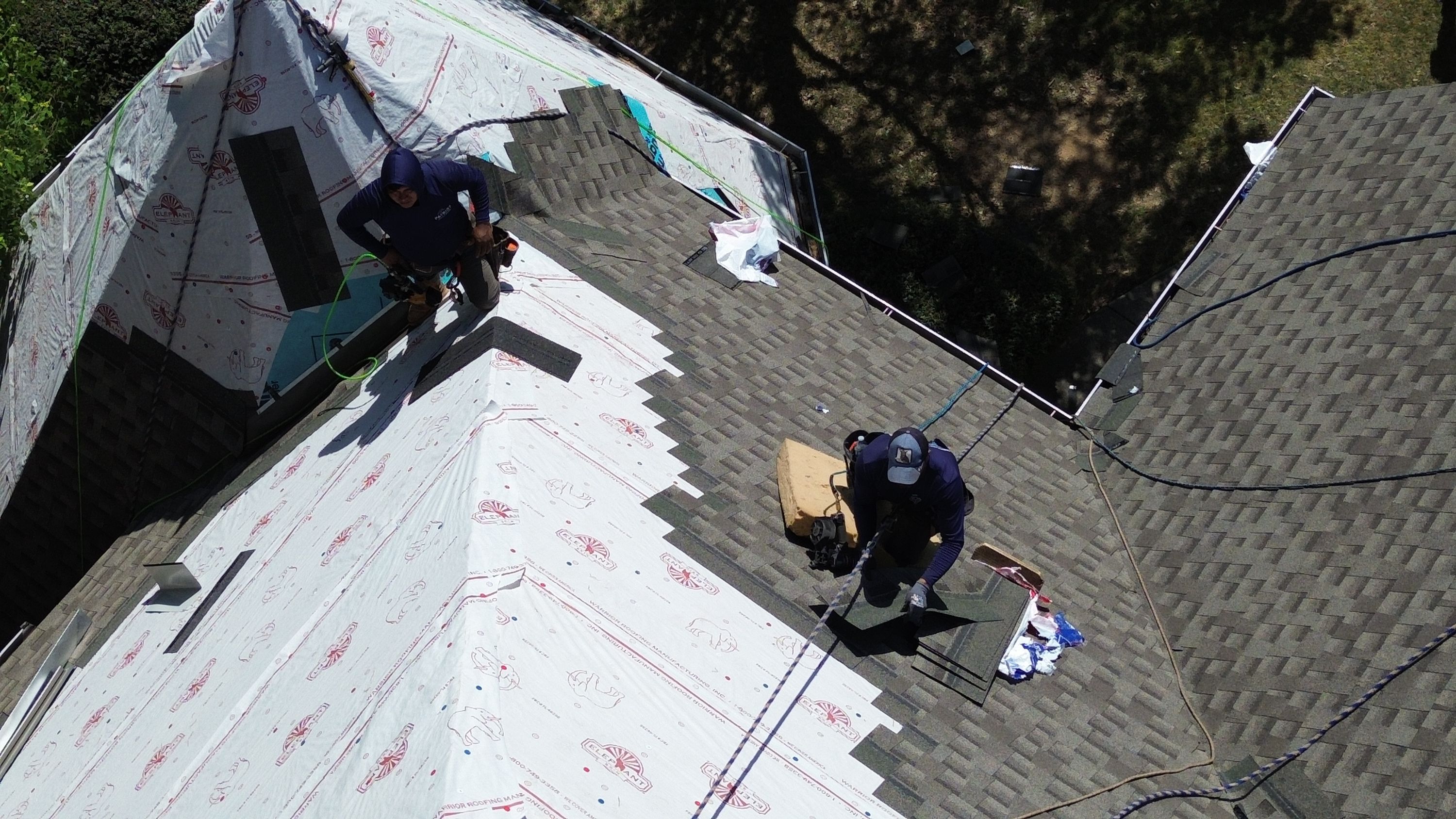 Patriot roofers install architectural shingles over synthetic underlayment during a Windchase roof replacement.