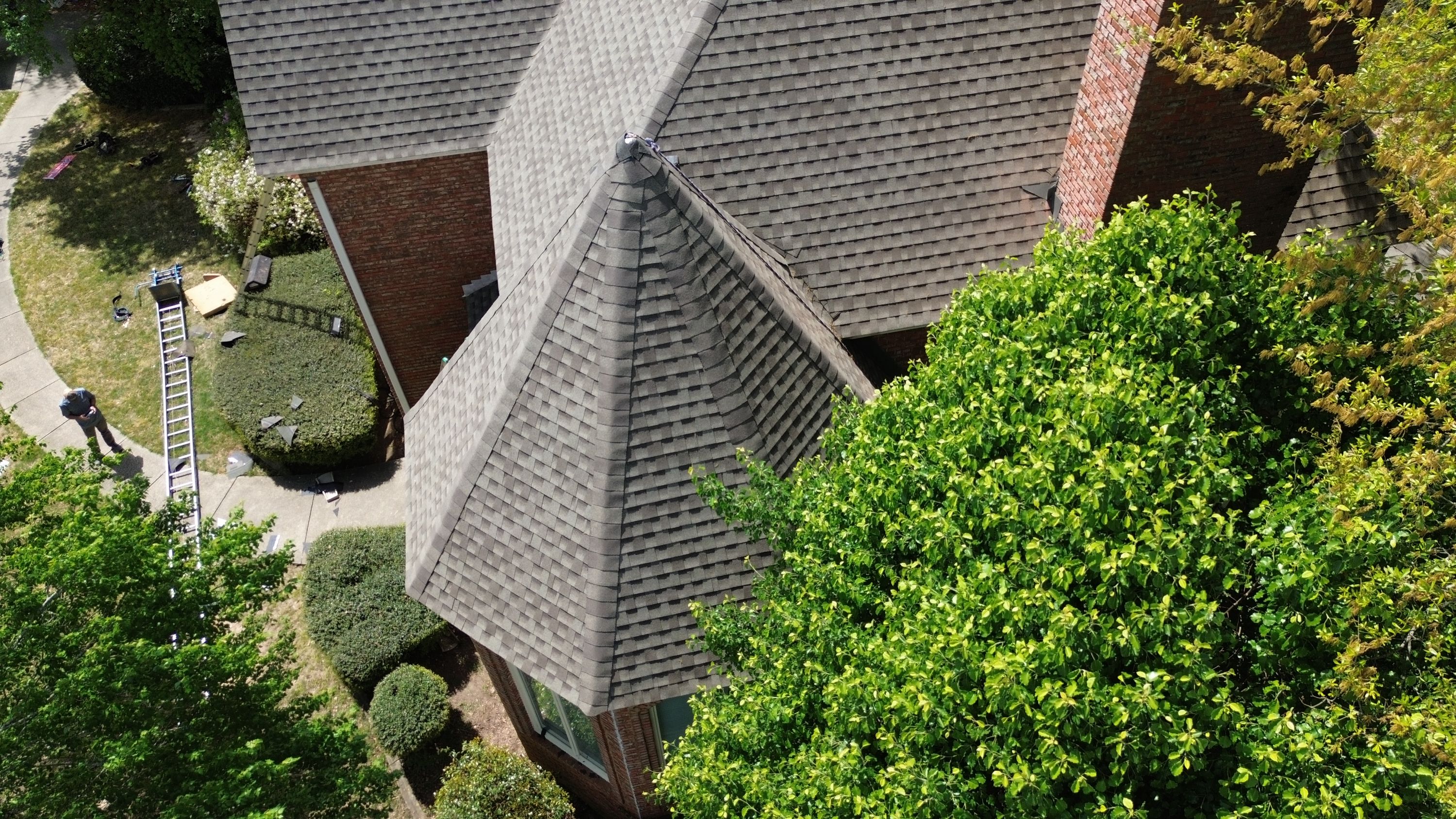Patriot Roofing and Builders installed new architectural shingles on the turret and valleys of this Hoover home.