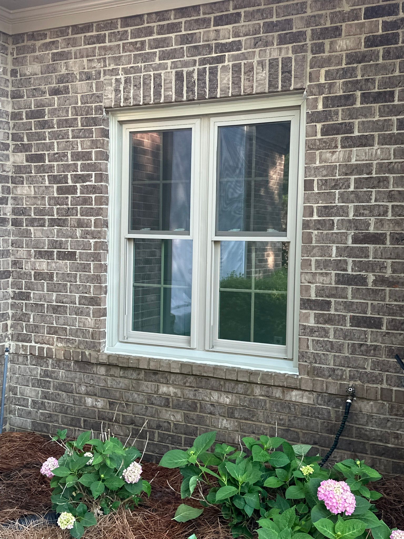 A newly installed double-hung window on a brick house in the Bluff Park neighborhood of Hoover.