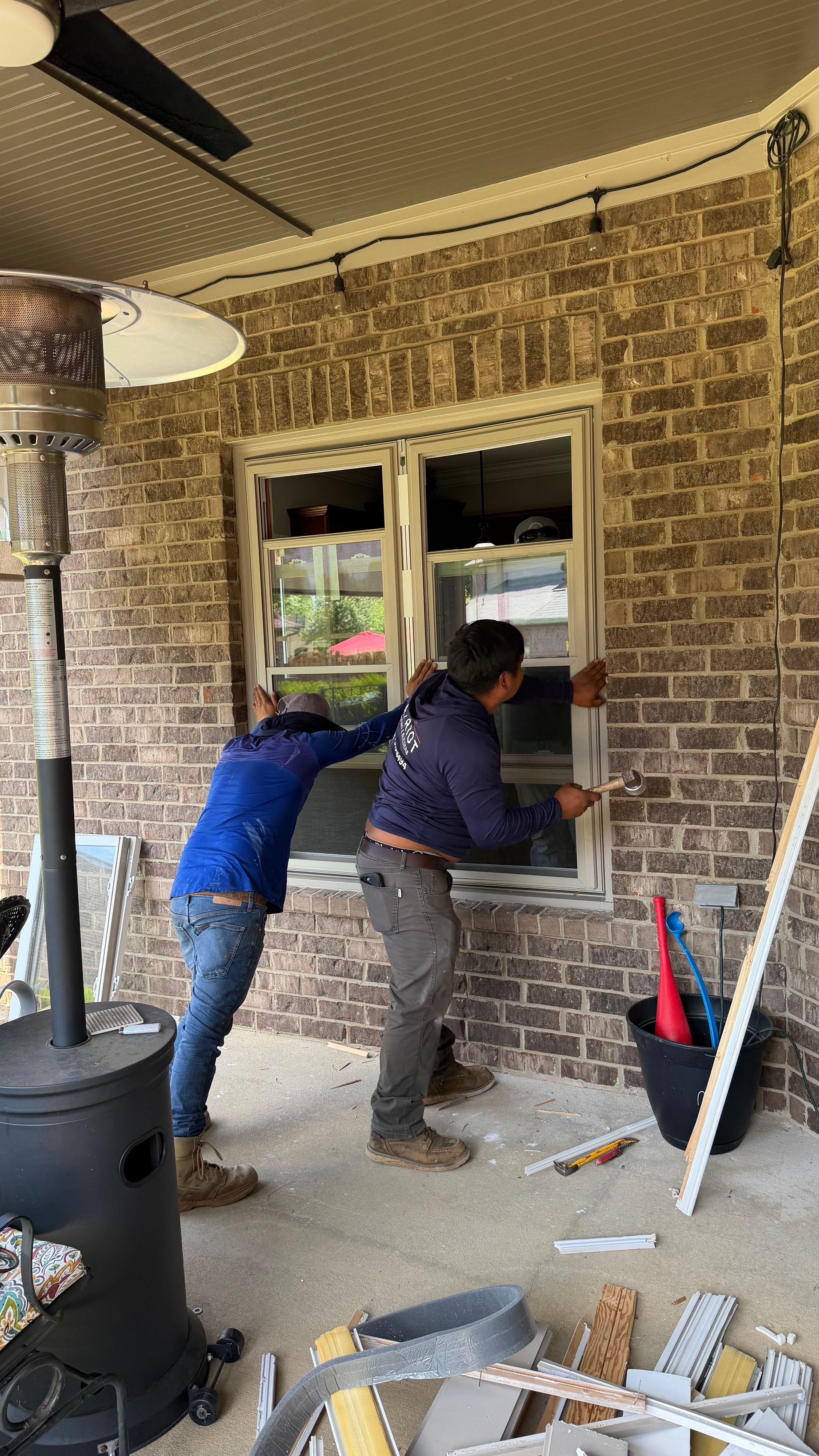 A new window is being installed in a brick home in the Bluff Park neighborhood of Hoover.