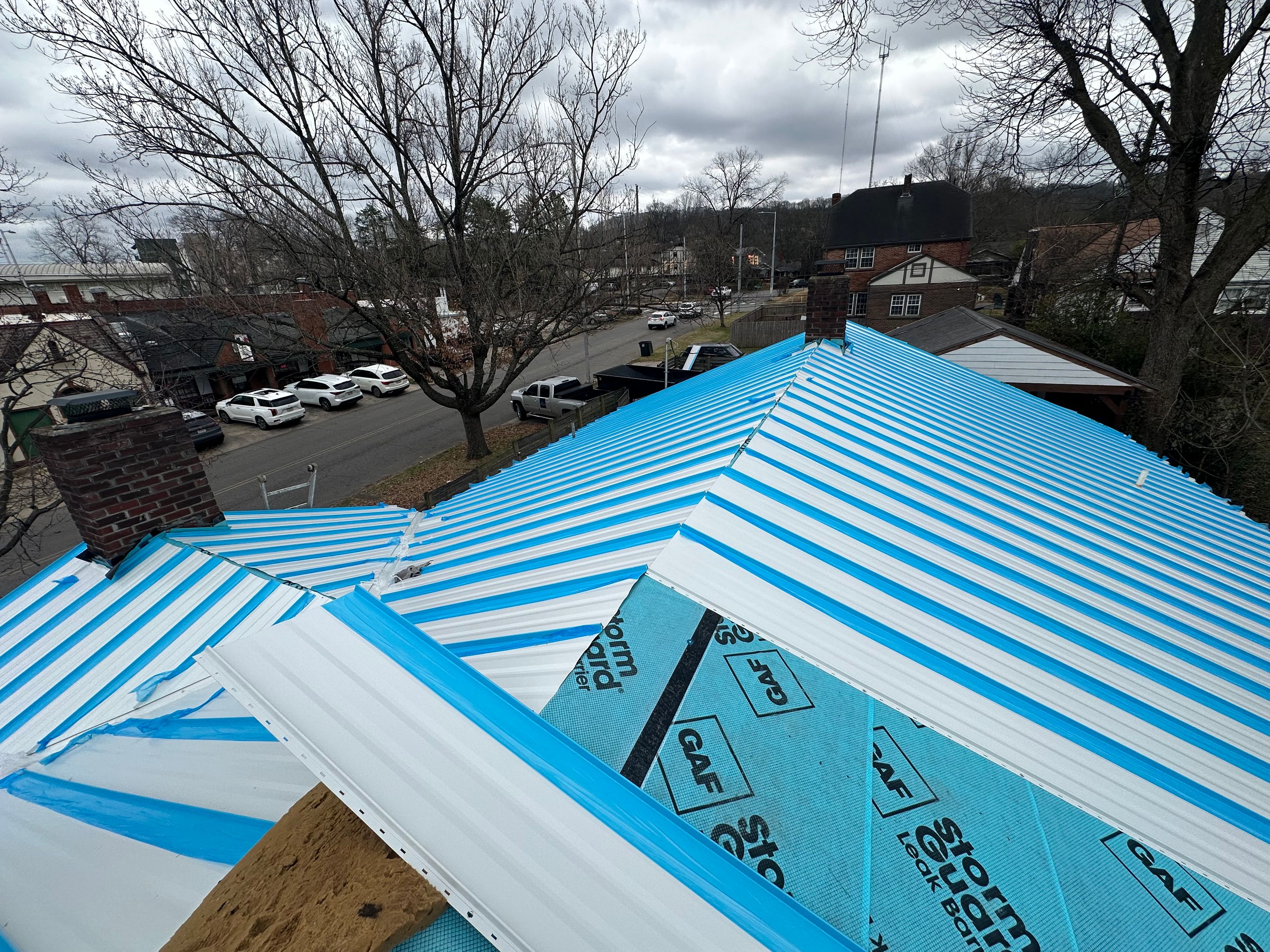 Residential roof replacement in Glen Iris, Birmingham, featuring GAF StormGuard leak barrier installation.