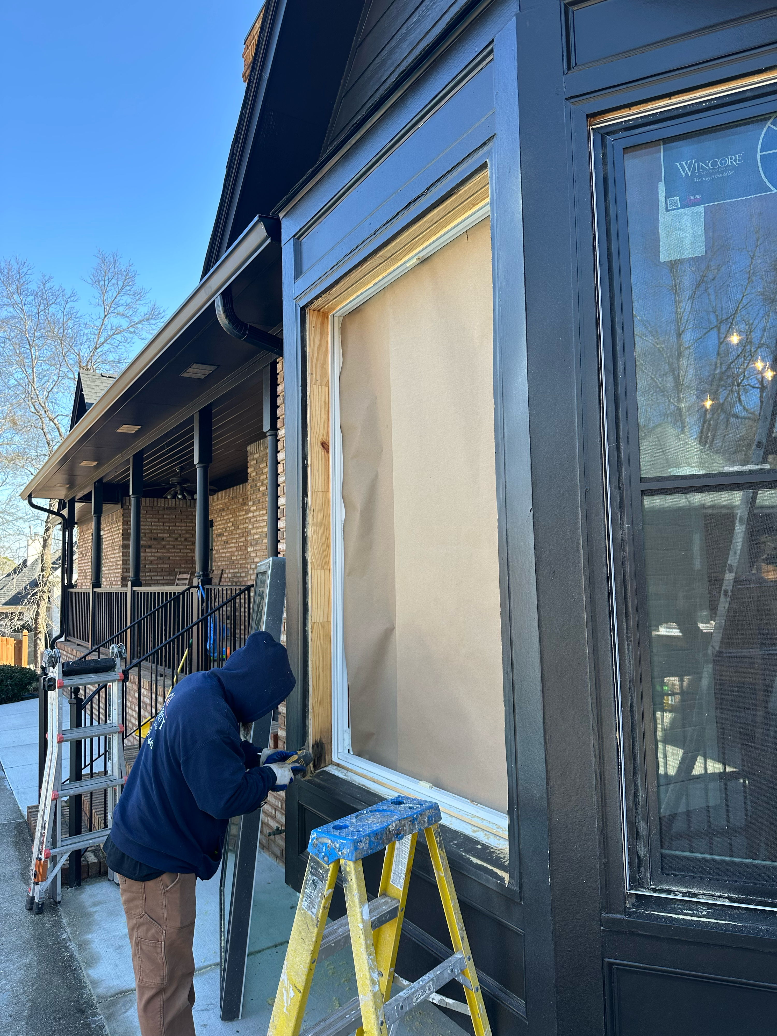 Contractor prepping the frame for a high-efficiency window replacement in Hoover, Alabama.