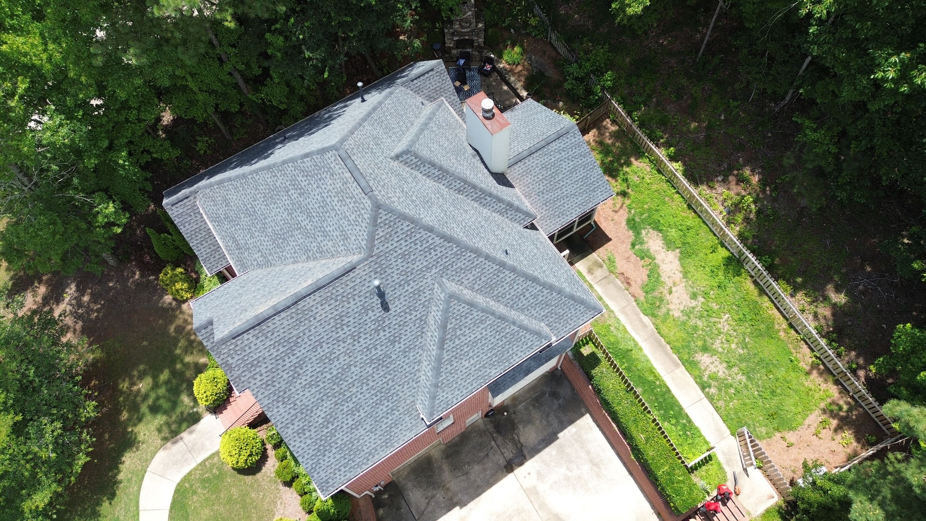 Aerial view of a completed architectural shingle roof replacement on a home in Hoover.
