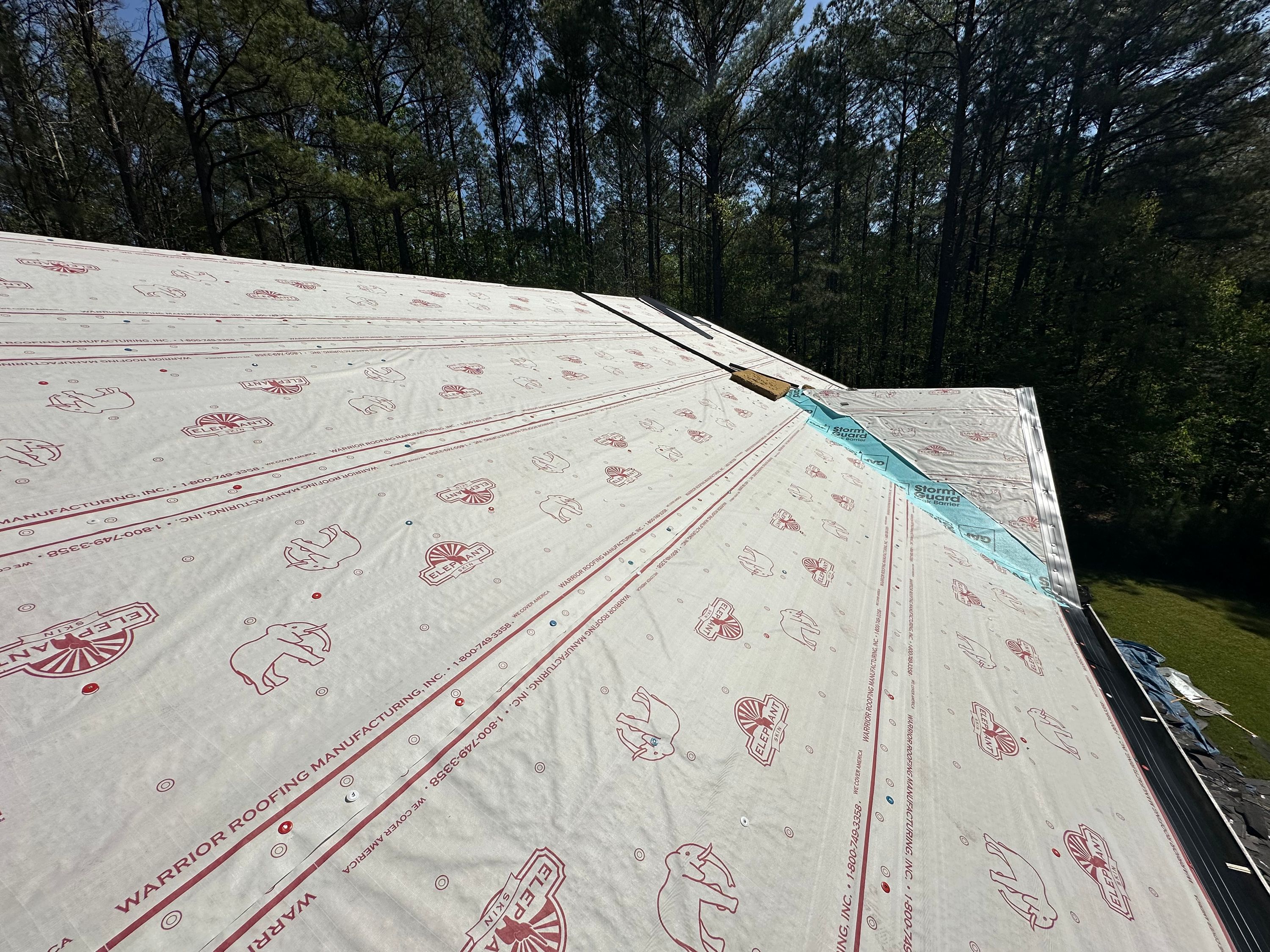 A roof replacement in progress with new underlayment and water barrier installed on a home in Chelsea.