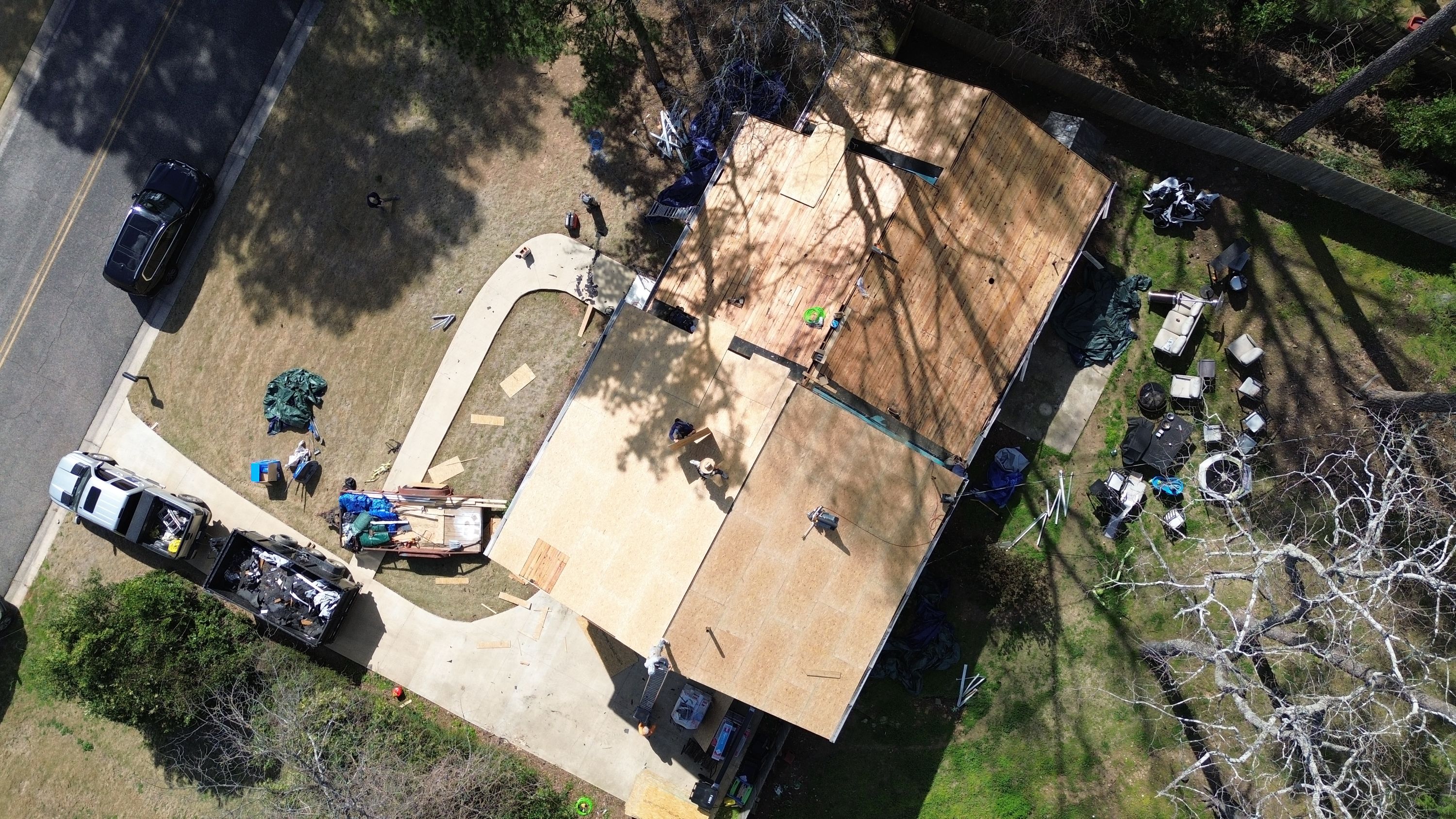 Overhead view of residential roof replacement with exposed wood decking in Brookwood Forest, Mountain Brook.