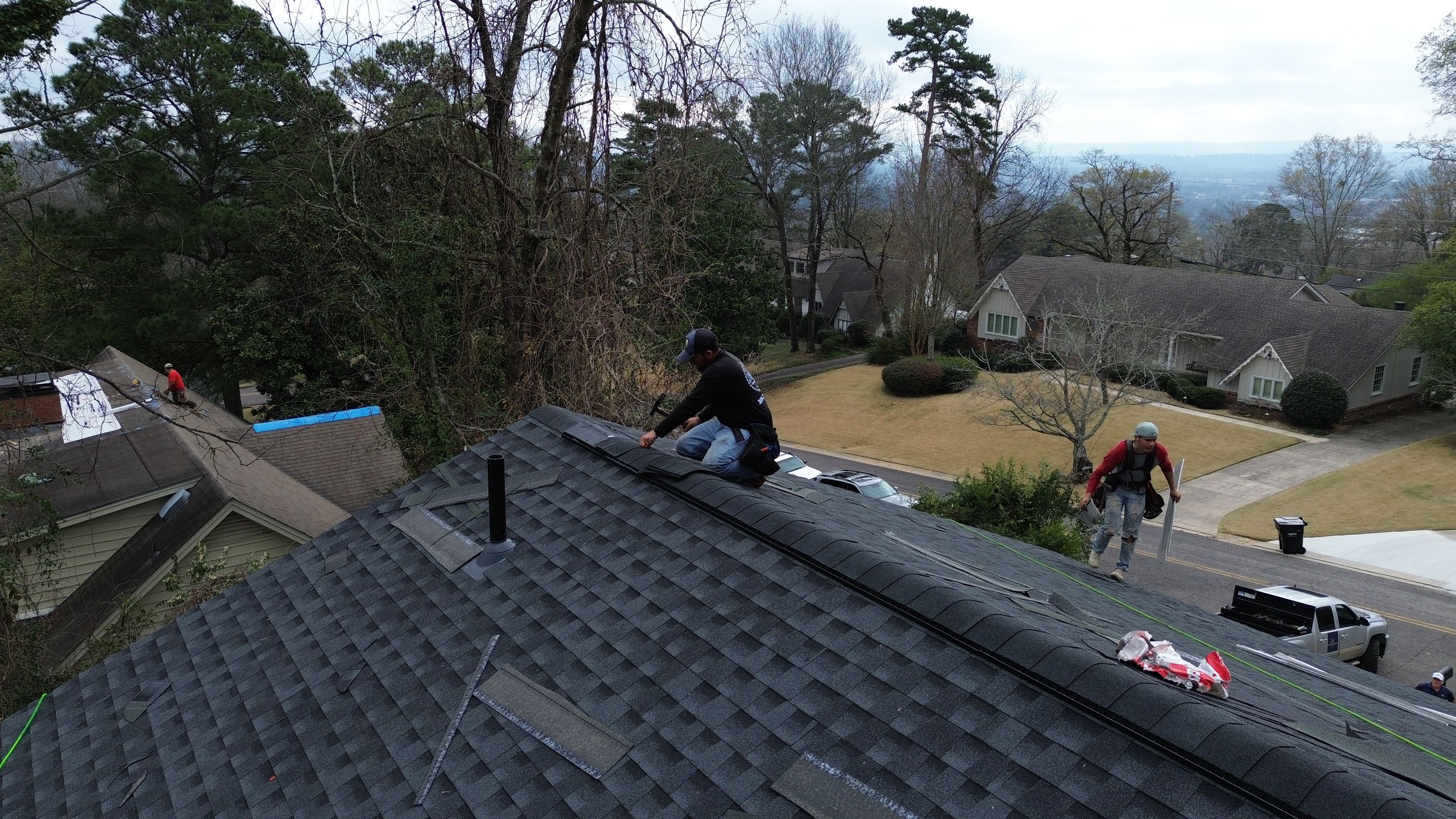 Professional roof replacement service in progress on a residential home in Brookwood Forest, Mountain Brook.