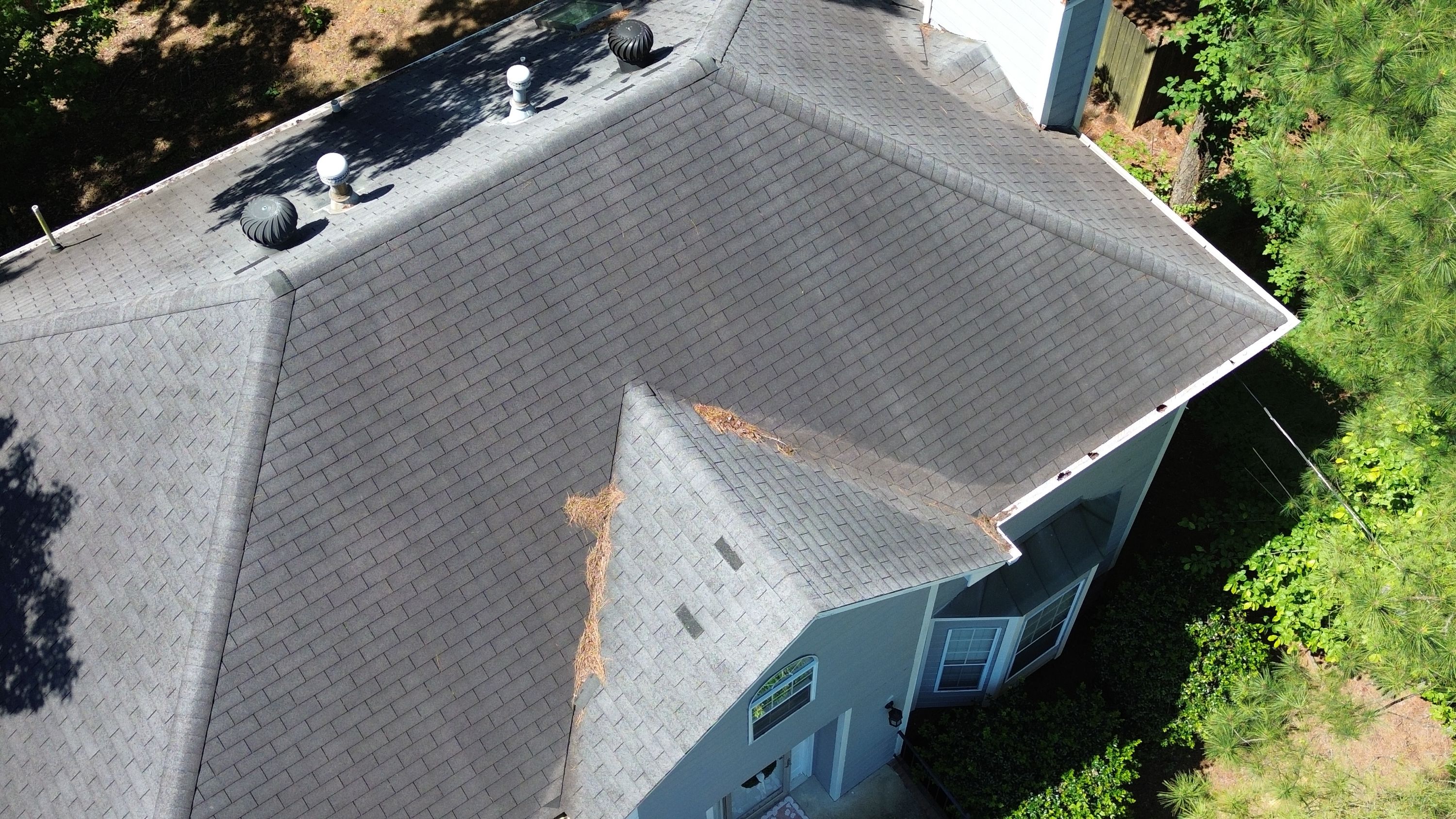 Before image of existing  gray asphalt shingles from a roof replacement on a home in Fieldstone Park, Helena.