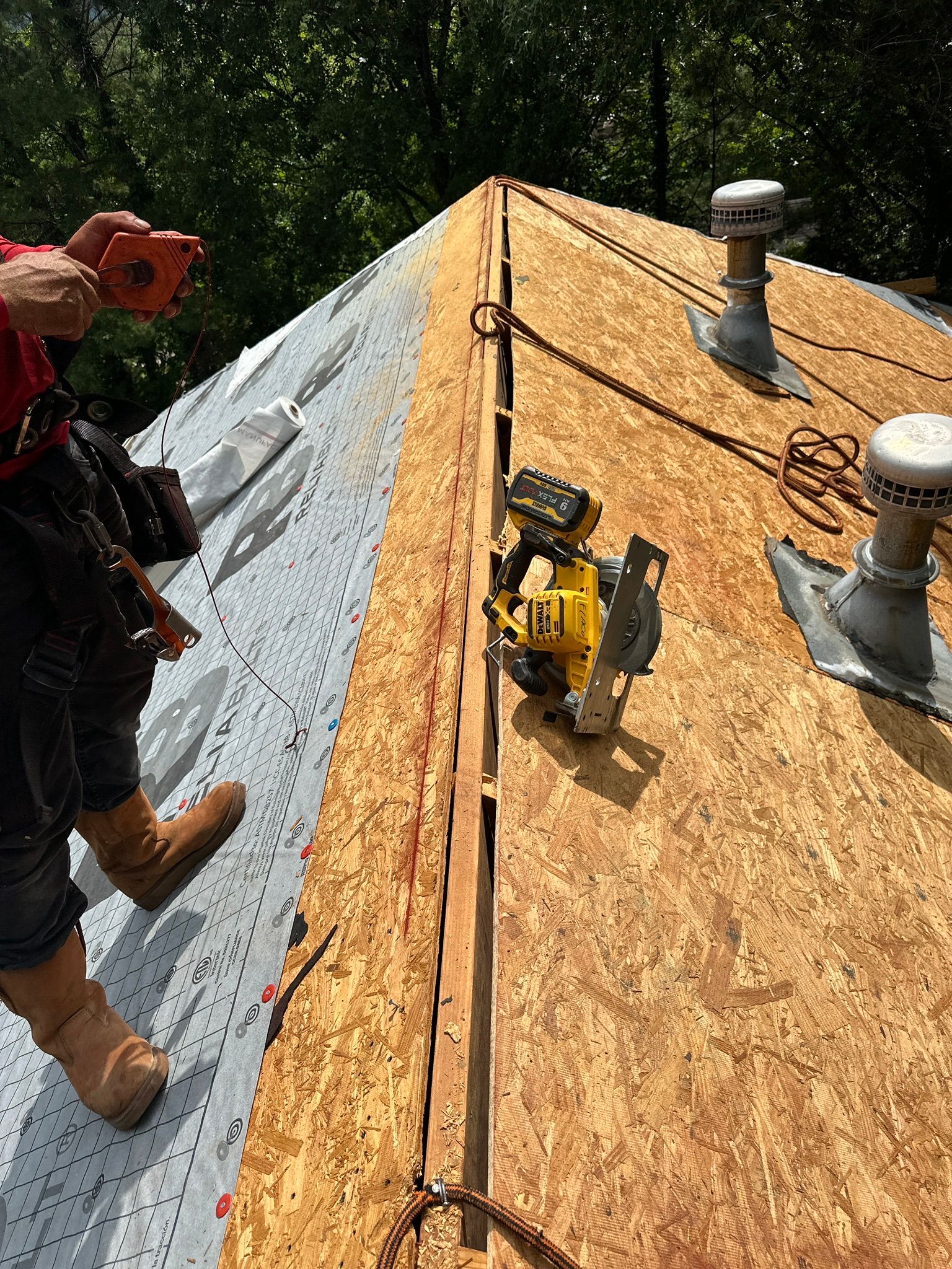 Roof replacement in Helena featuring new OSB decking and synthetic underlayment installation.