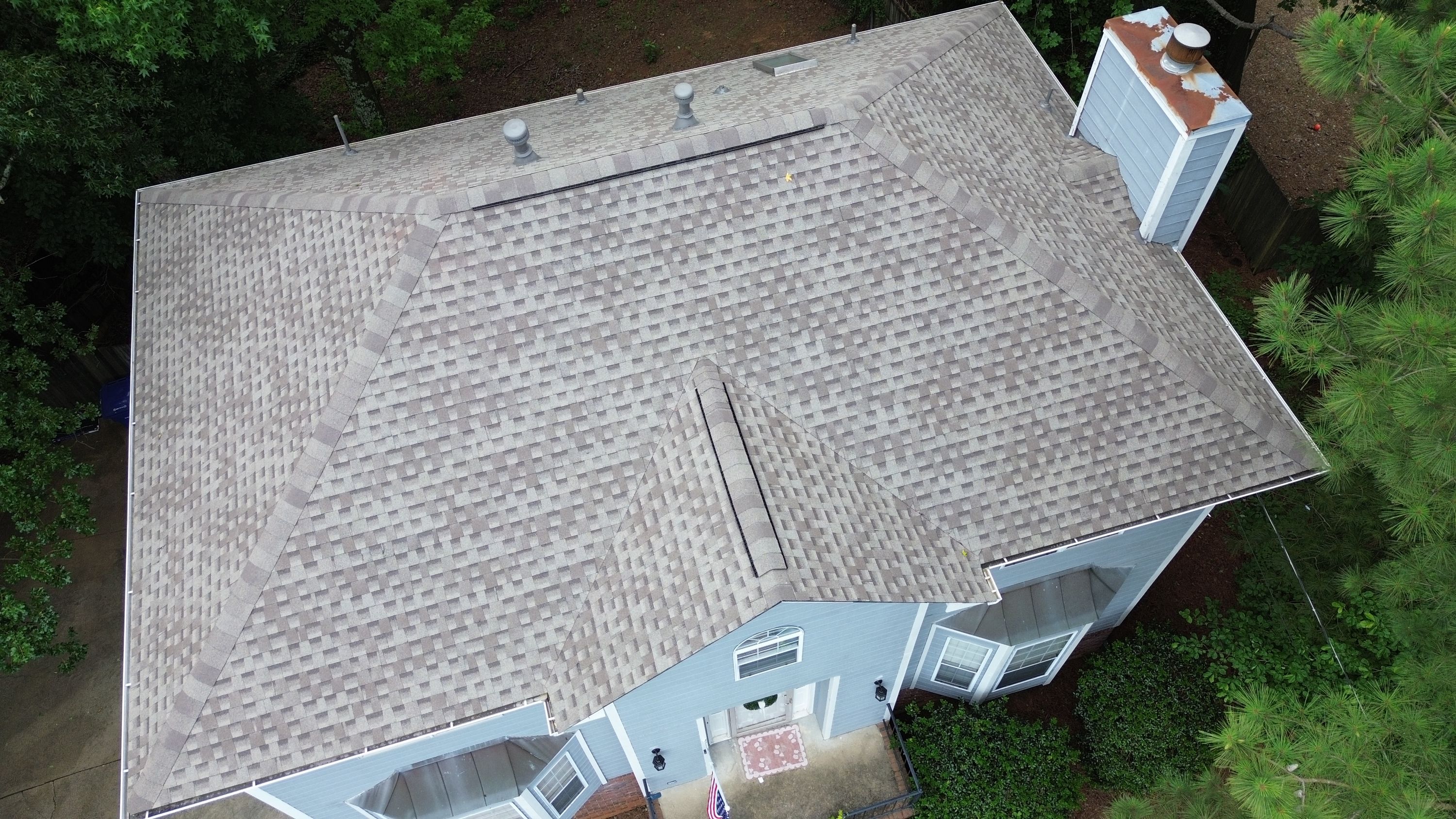 Completed residential roof replacement with new shingles on a home in Fieldstone Park, Helena.
