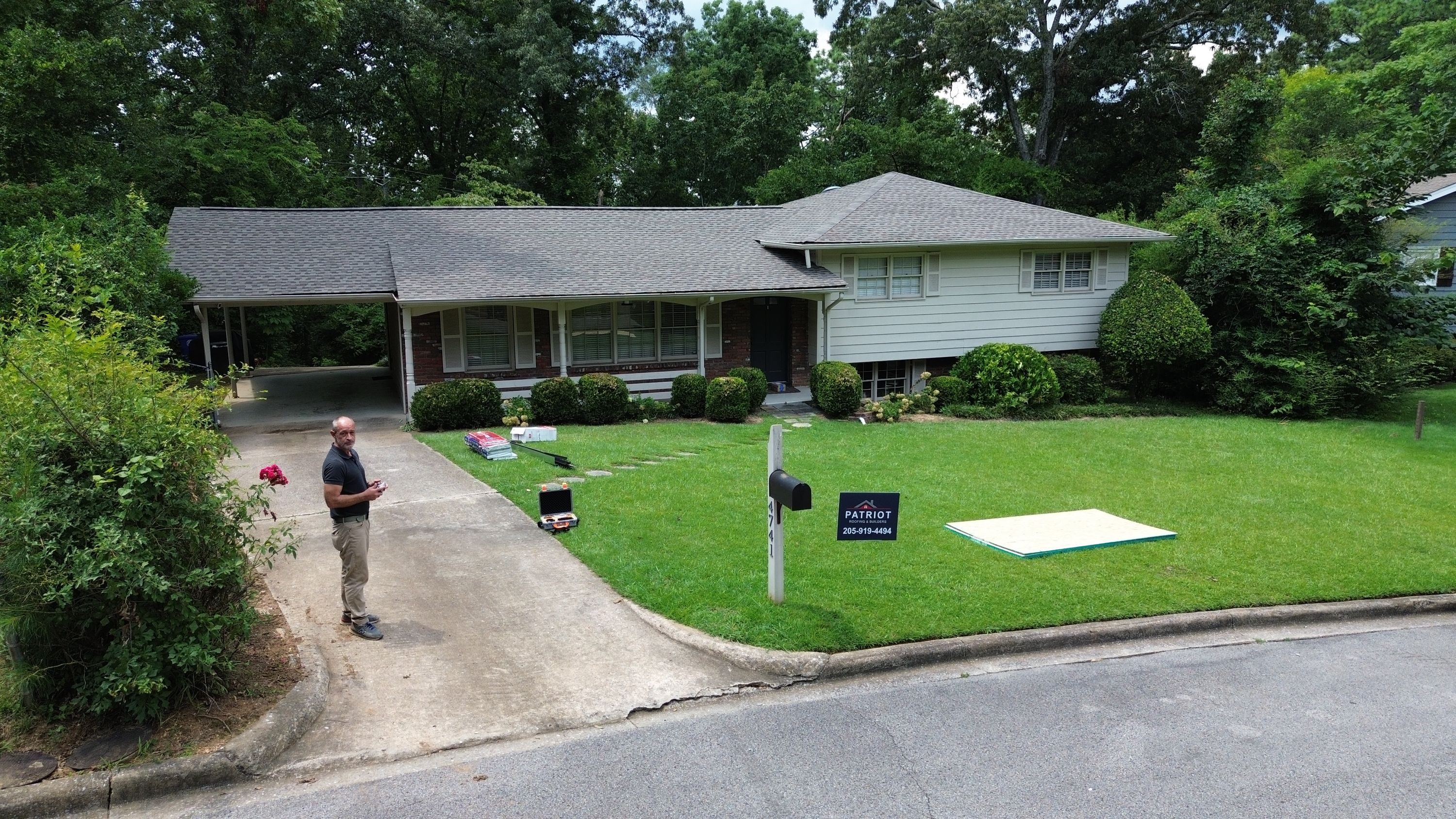 A completed asphalt shingle roof replacement covers this single-family home in Crestwood South.