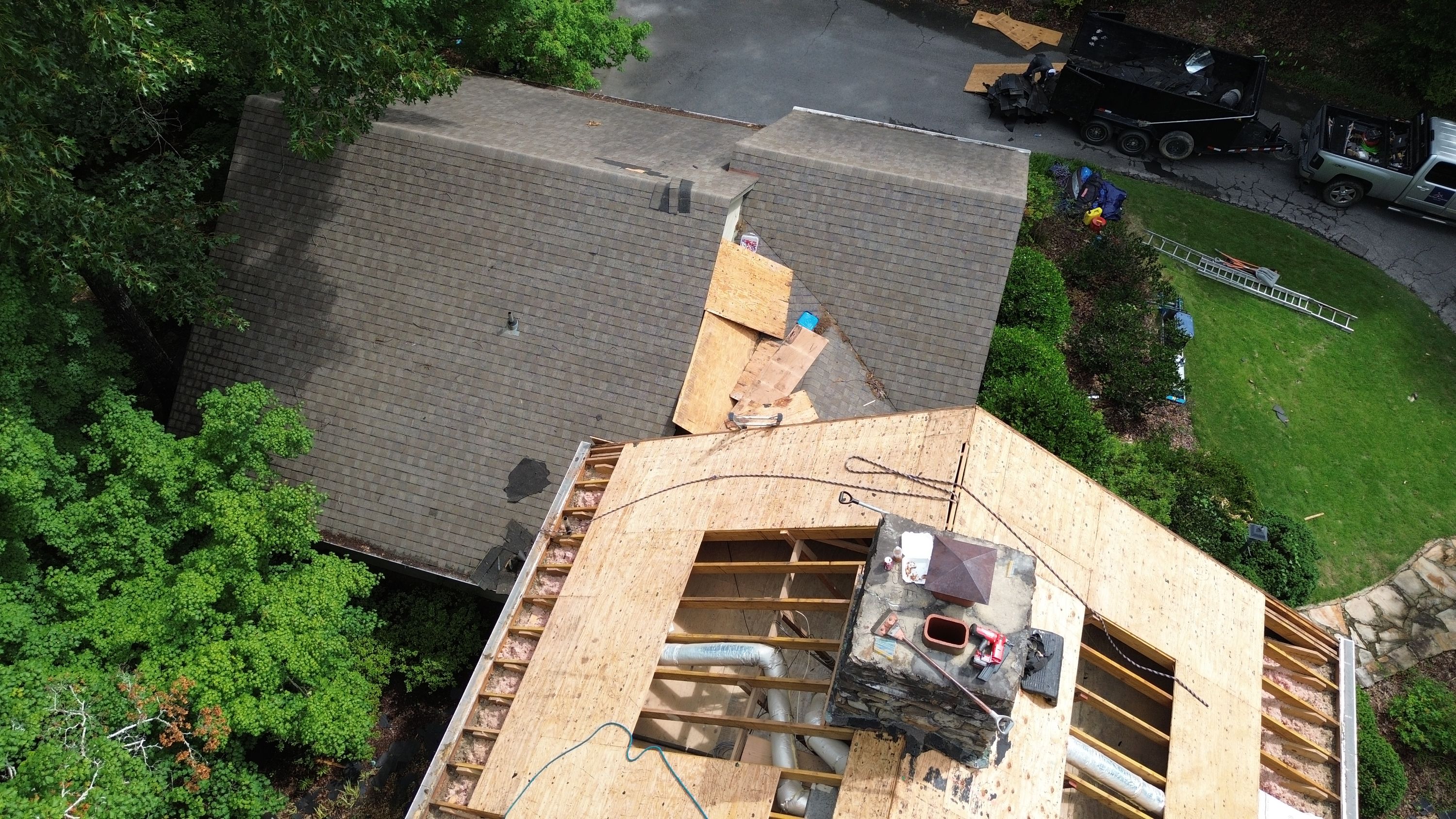 New plywood decking installed during a residential roof replacement in Mountain Brook.