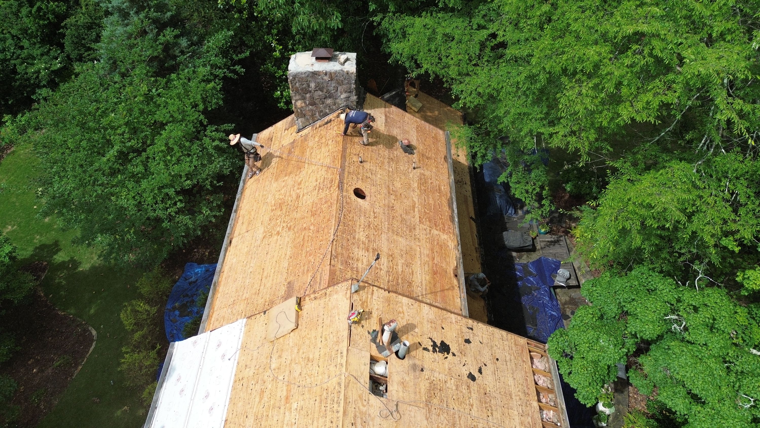 Aerial view of plywood decking during a roof replacement on Old Leeds Road in Mountain Brook.