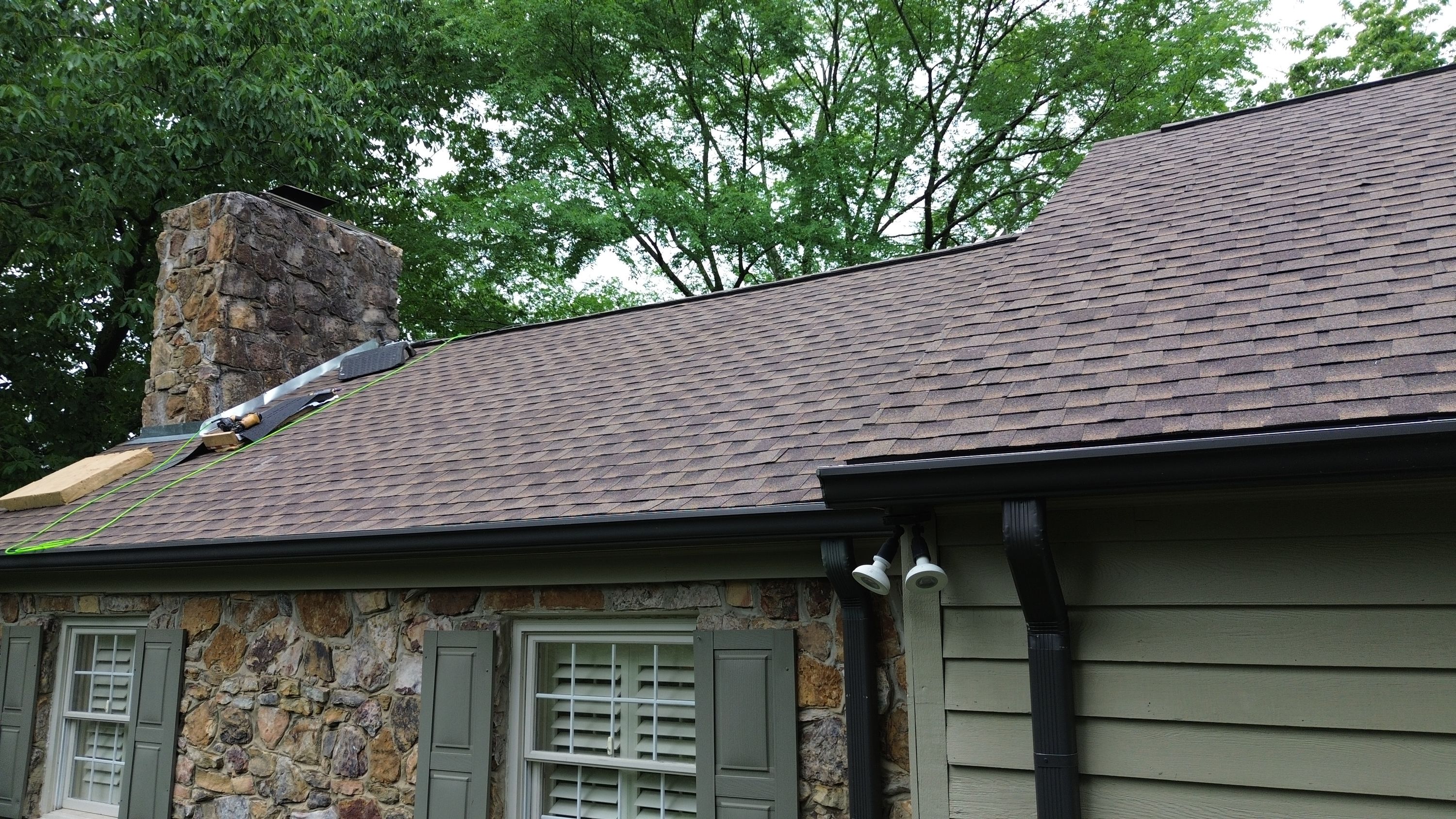 New brown shingles installed during a roof replacement on Old Leeds Road in Mountain Brook.
