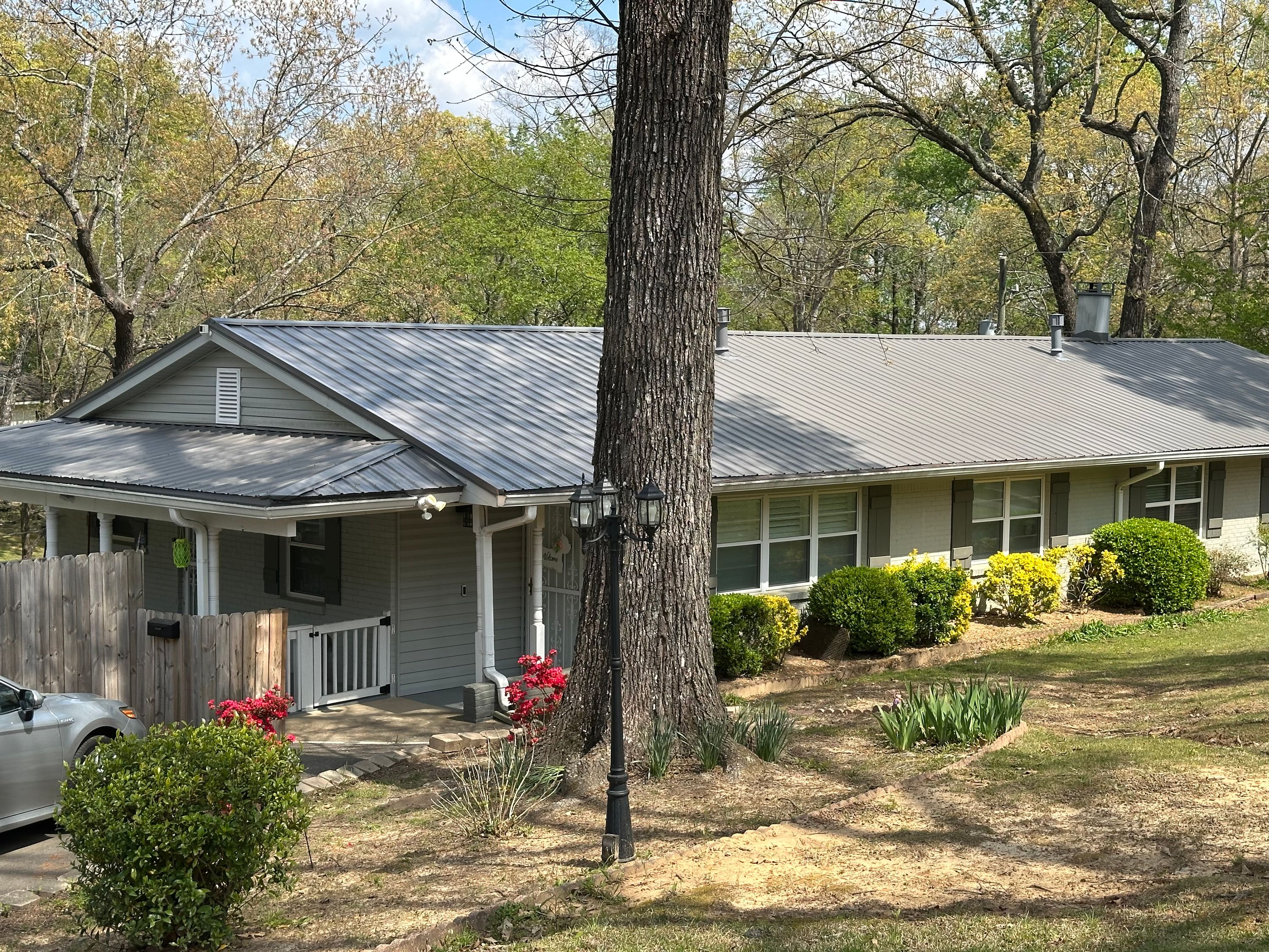Gray standing seam metal roof replacement completed on a home in Cahaba Heights.