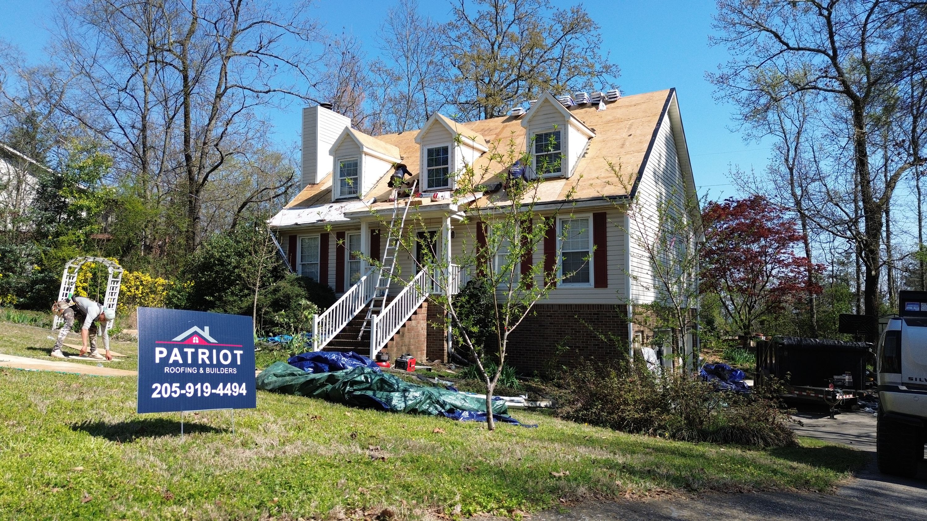 Residential roof replacement in progress on a Bluff Park home in Hoover by Patriot Roofing and Builders.