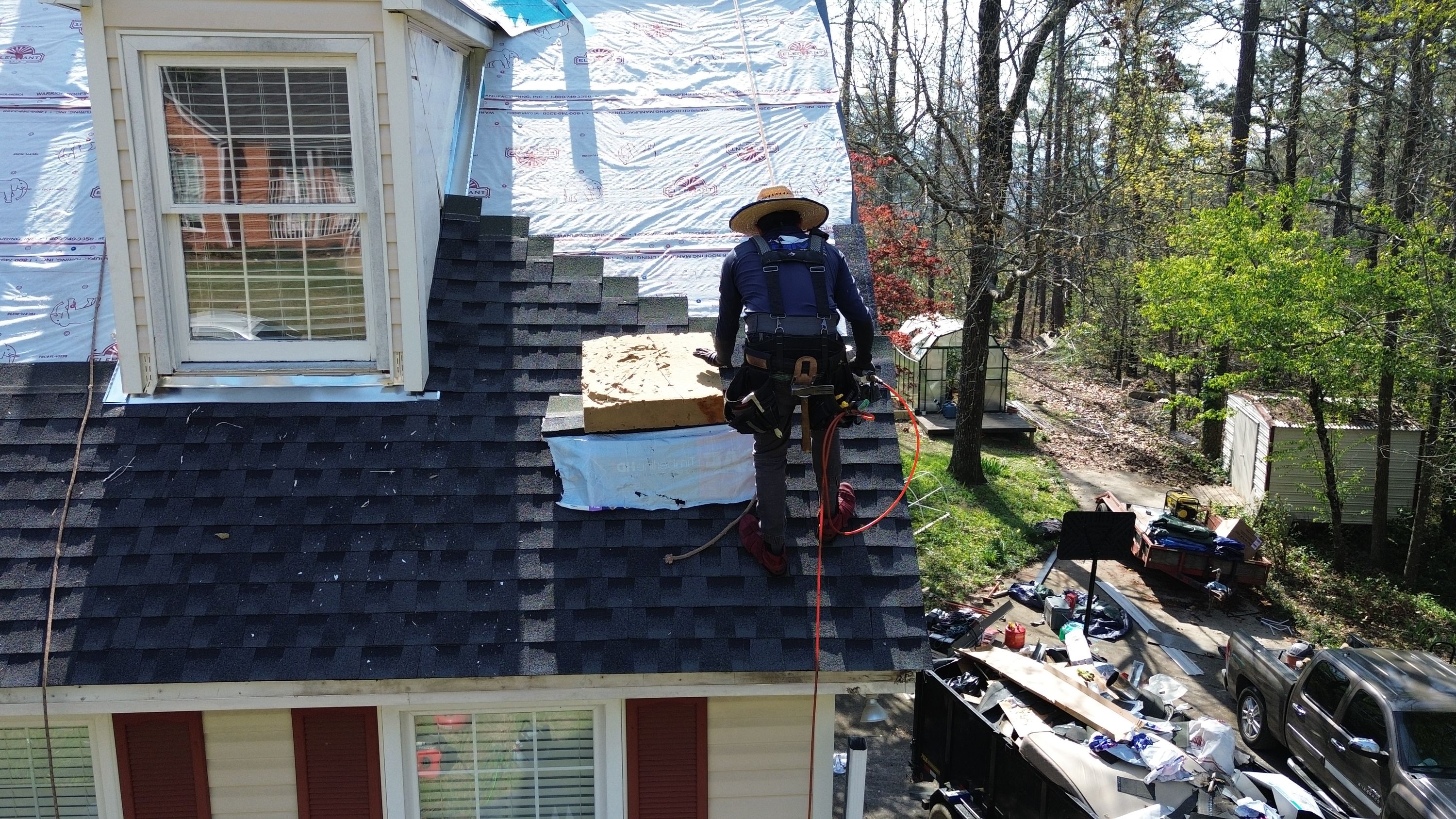 Patriot installs architectural shingles over synthetic underlayment during a roof replacement in Bluff Park.