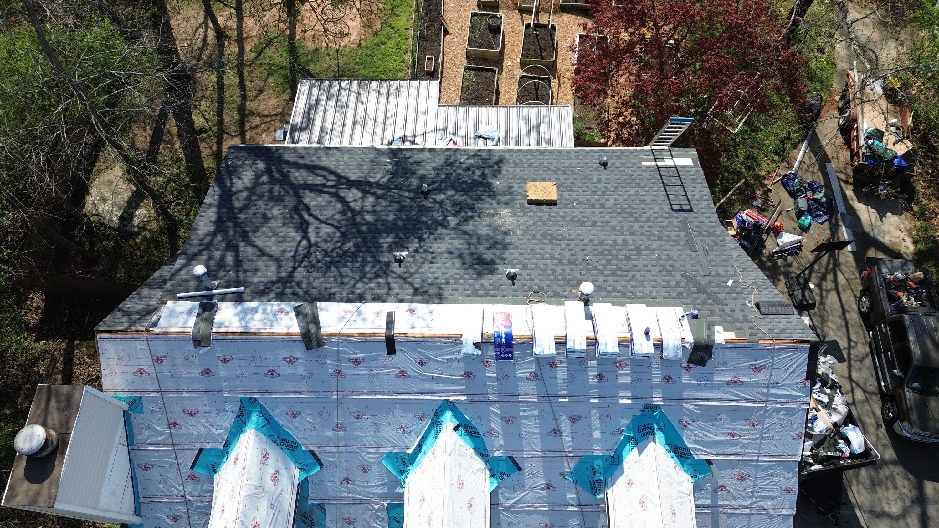 Patriot installs synthetic underlayment and architectural shingles during a roof replacement in Hoover.