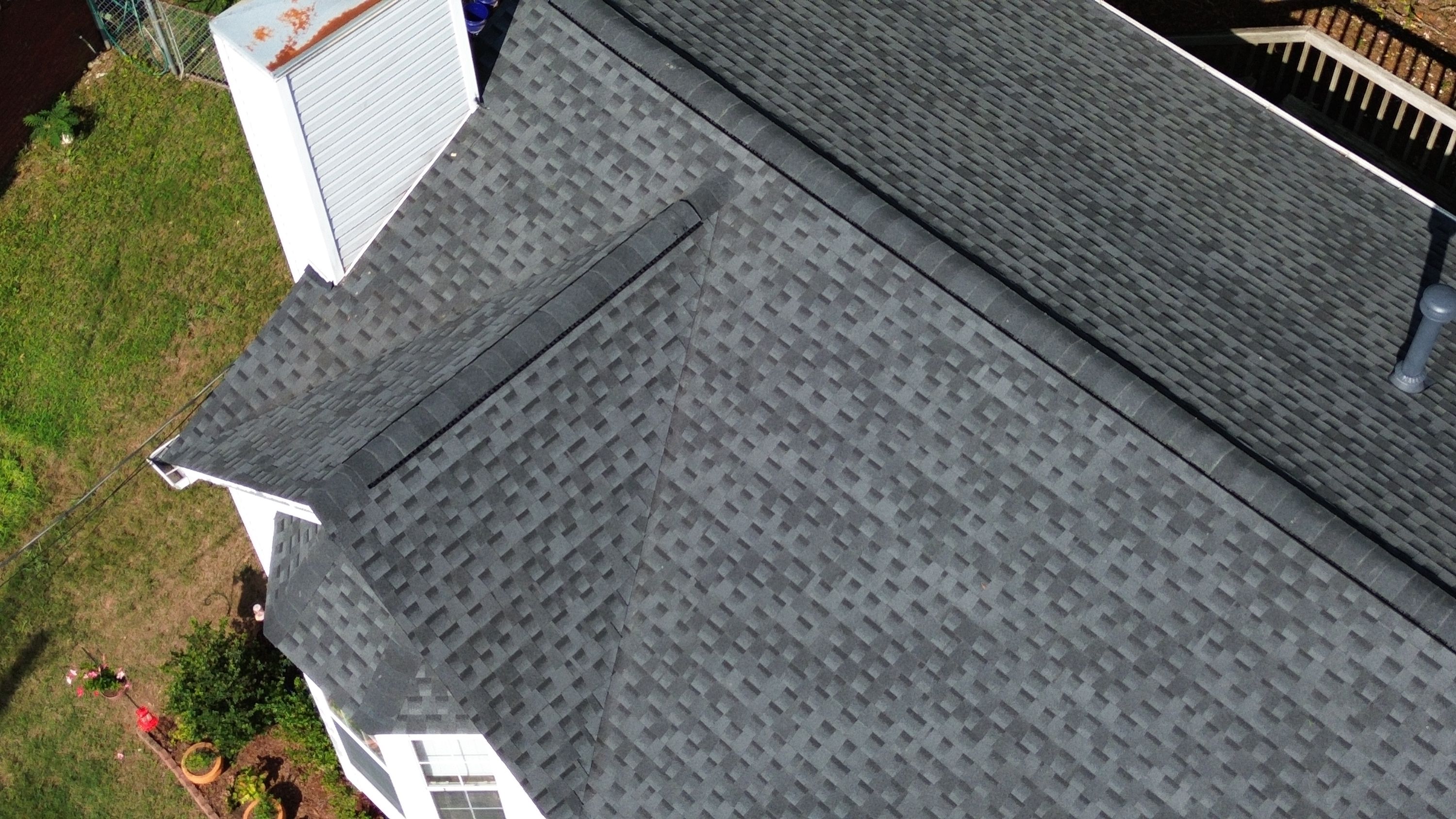 Shingles overlap securely along a roof valley to ensure reliable water runoff.