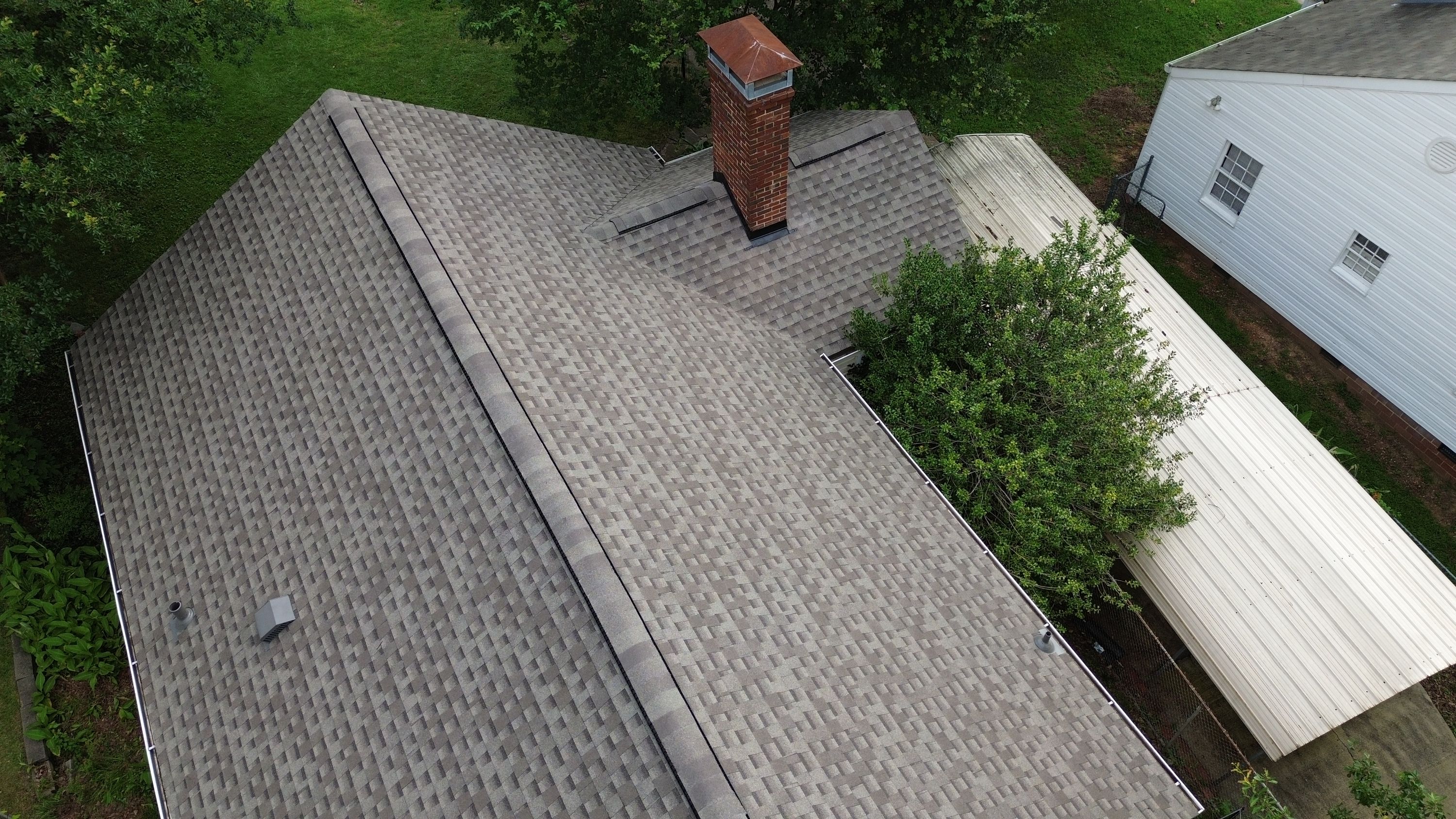 Completed roof replacement with new grey shingles on a home in Glen Iris, Birmingham.