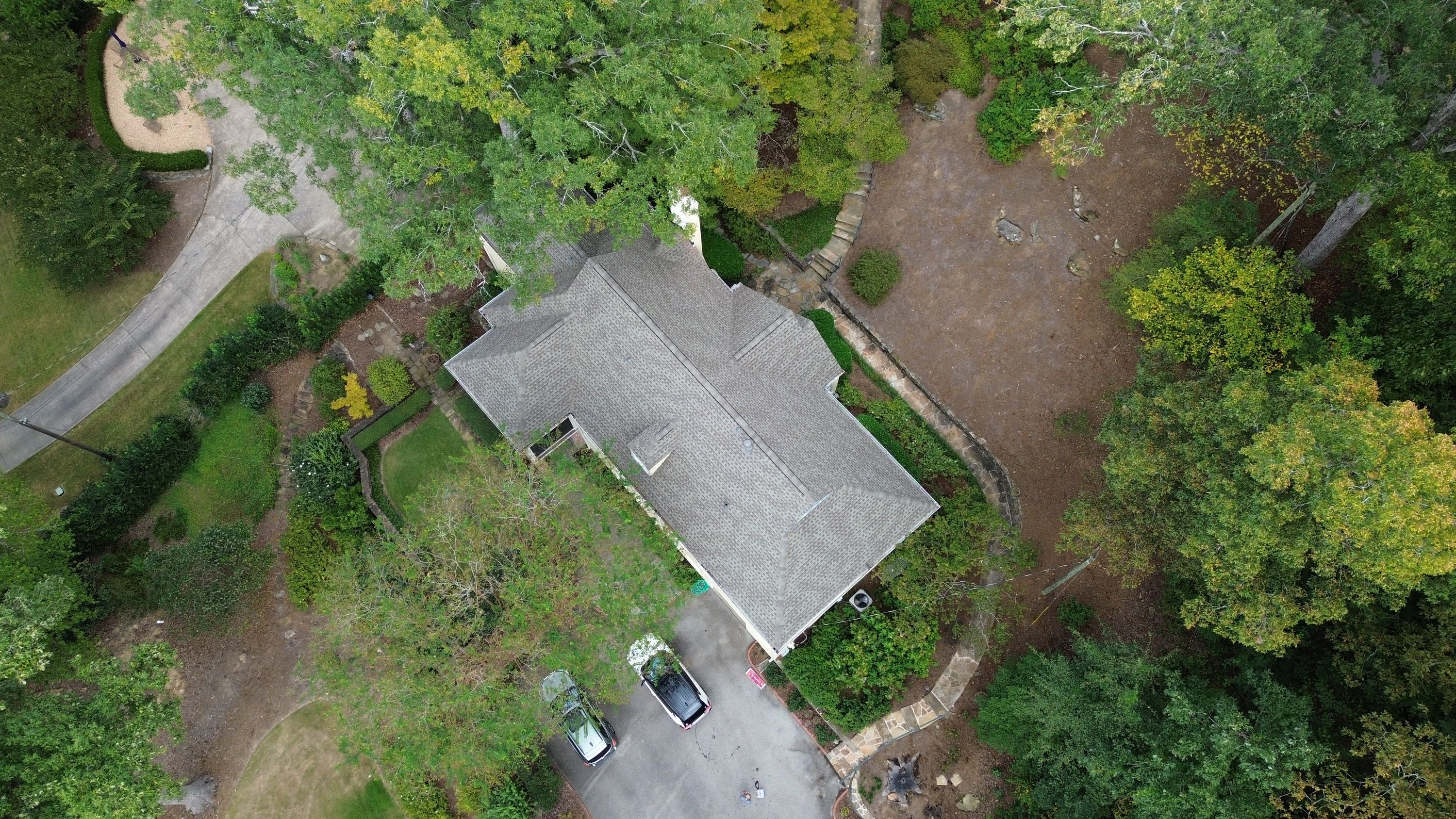 An aerial view displays the completed roof replacement on Overhill Road in Mountain Brook.