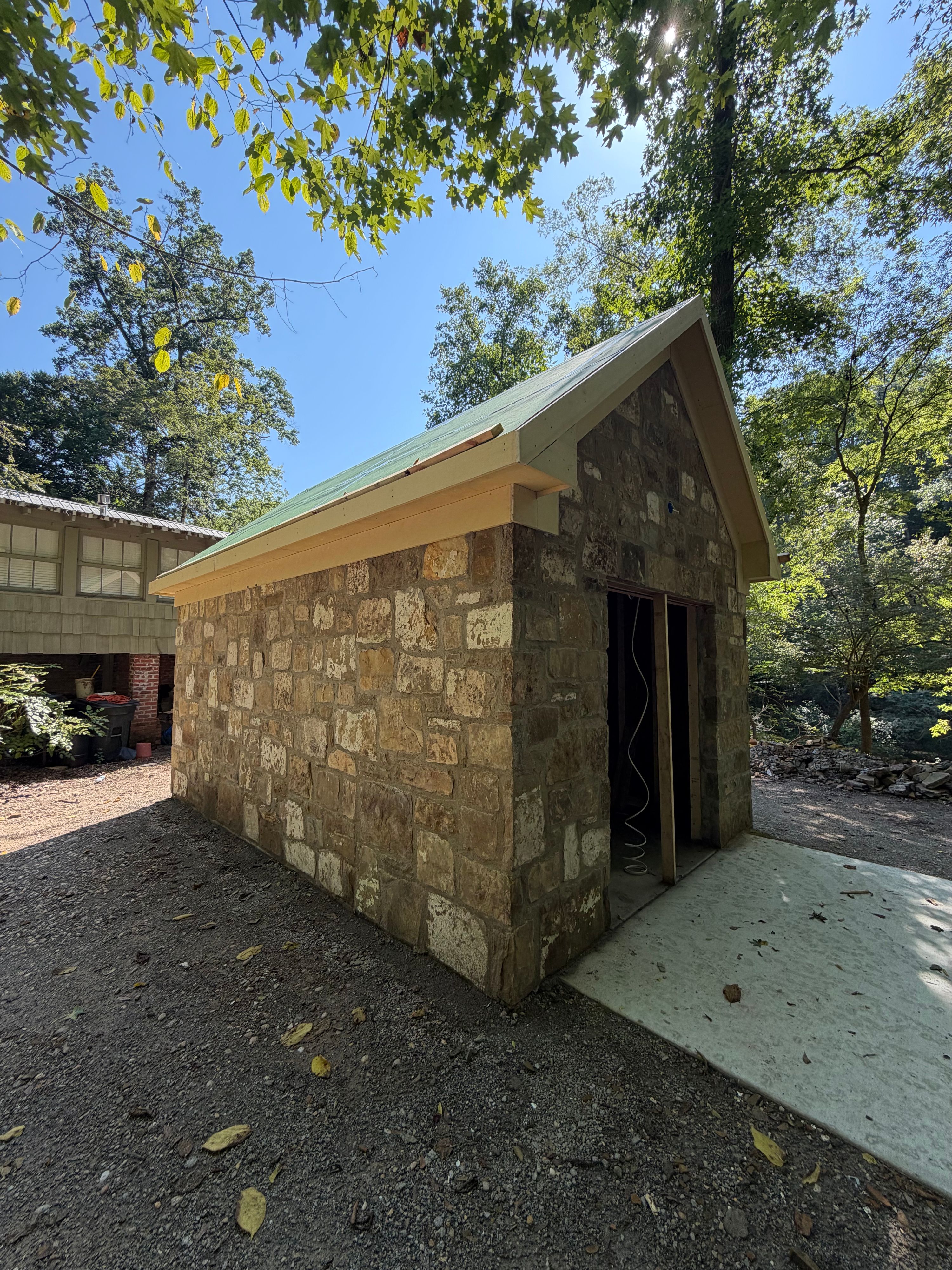 Corner view of the corn shed showing reclaimed rock walls with traces of original paint, Vestavia Hills, AL