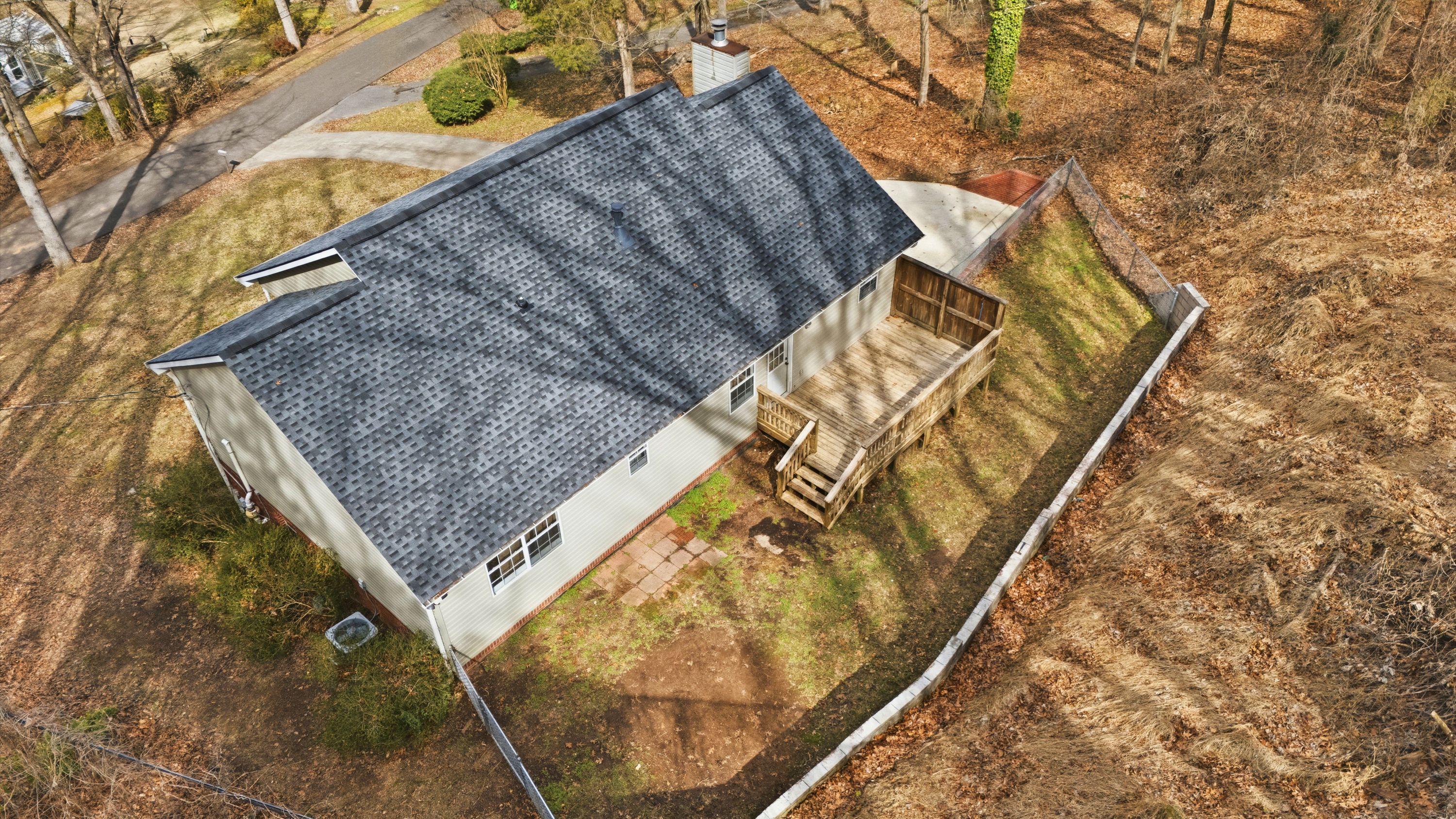 Elevated view of a newly installed asphalt shingle roof in Leeds, AL, highlighting the precision of our roofing services.