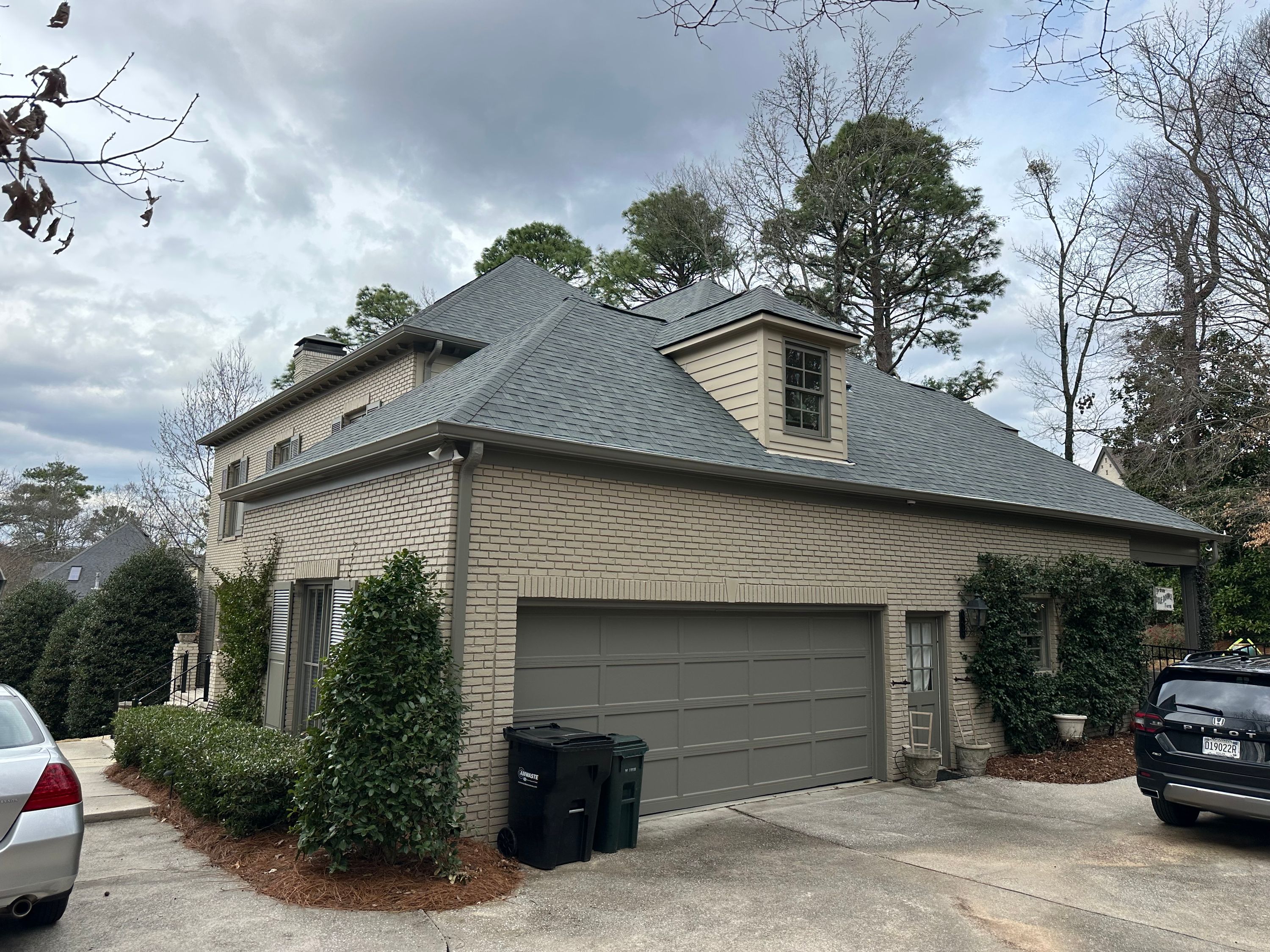 Close-up of newly installed architectural shingles on a garage and dormer in Altadena Valley, Alabama.
