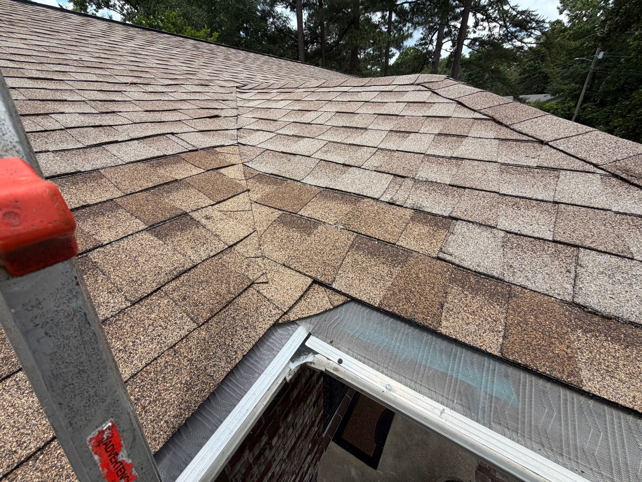 Roof and gutter repair on an asphalt shingle roof in Cahaba Hills.