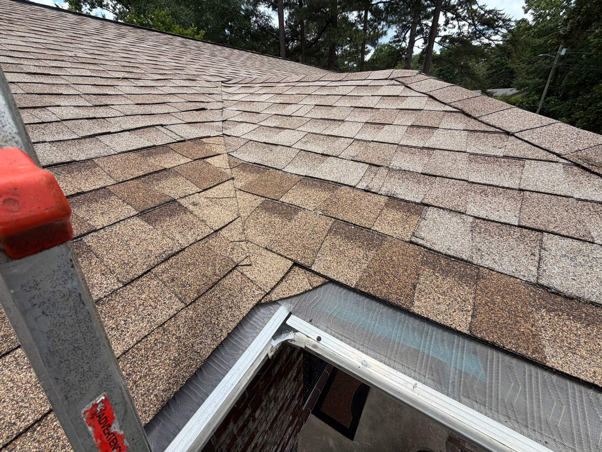 Roof and gutter repair on an asphalt shingle roof in Cahaba Hills.