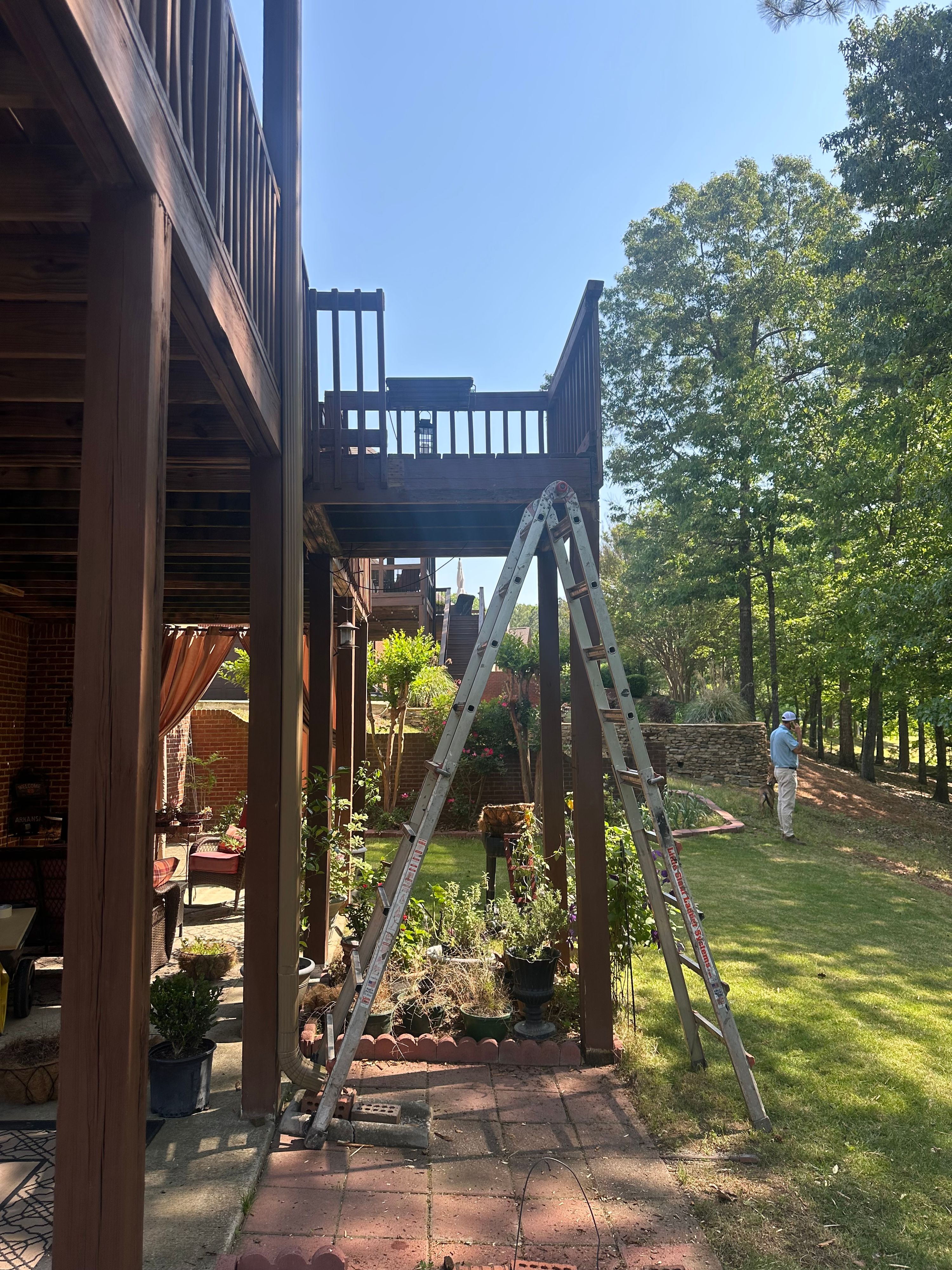 A ladder rests against a wooden deck under construction at a residence in Helena.