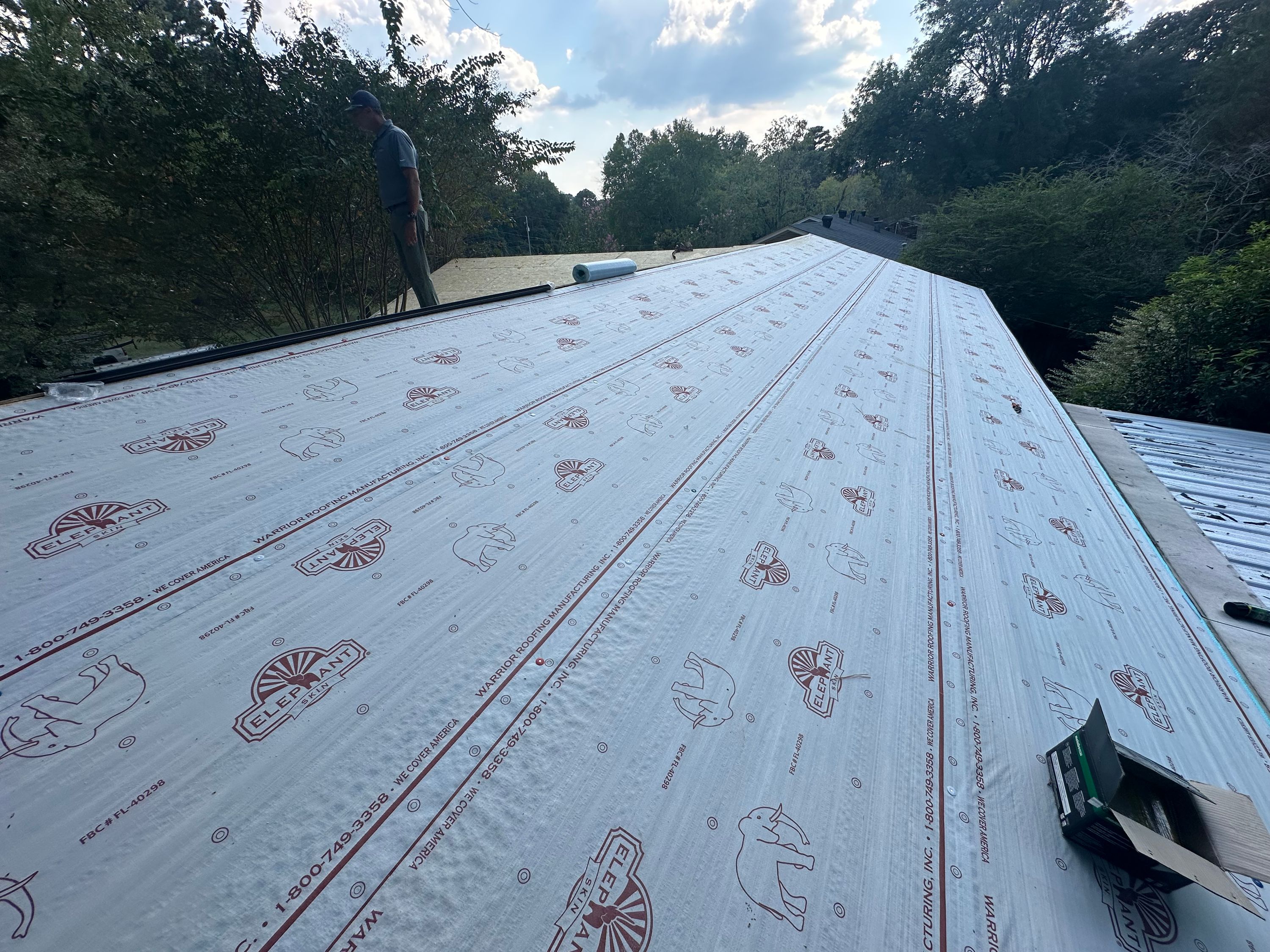 Roof replacement in Crestline Gardens, Birmingham, showing the installation of synthetic underlayment.