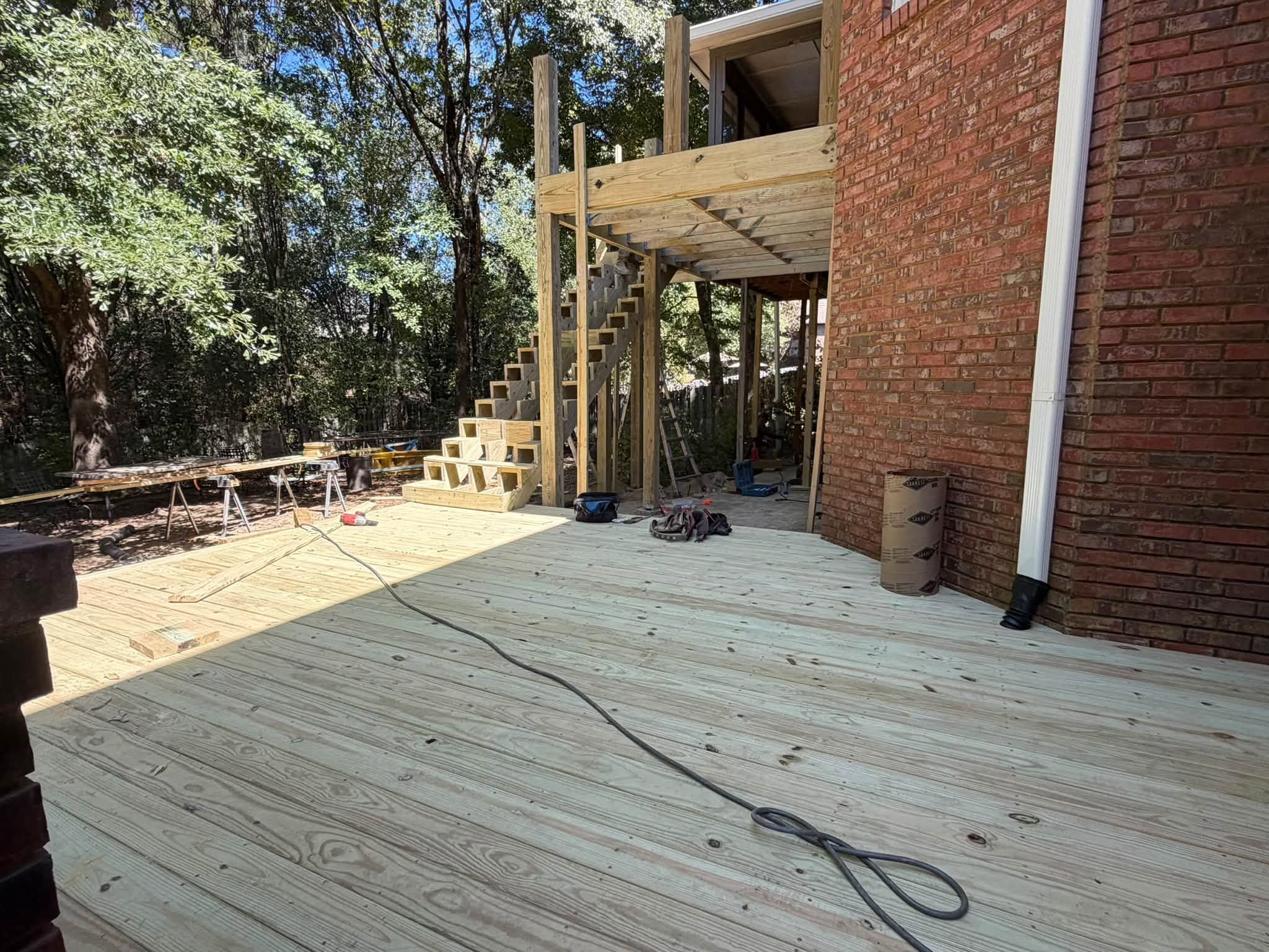 Pressure-treated wood decking boards installed on a custom deck in Windchase, Hoover.