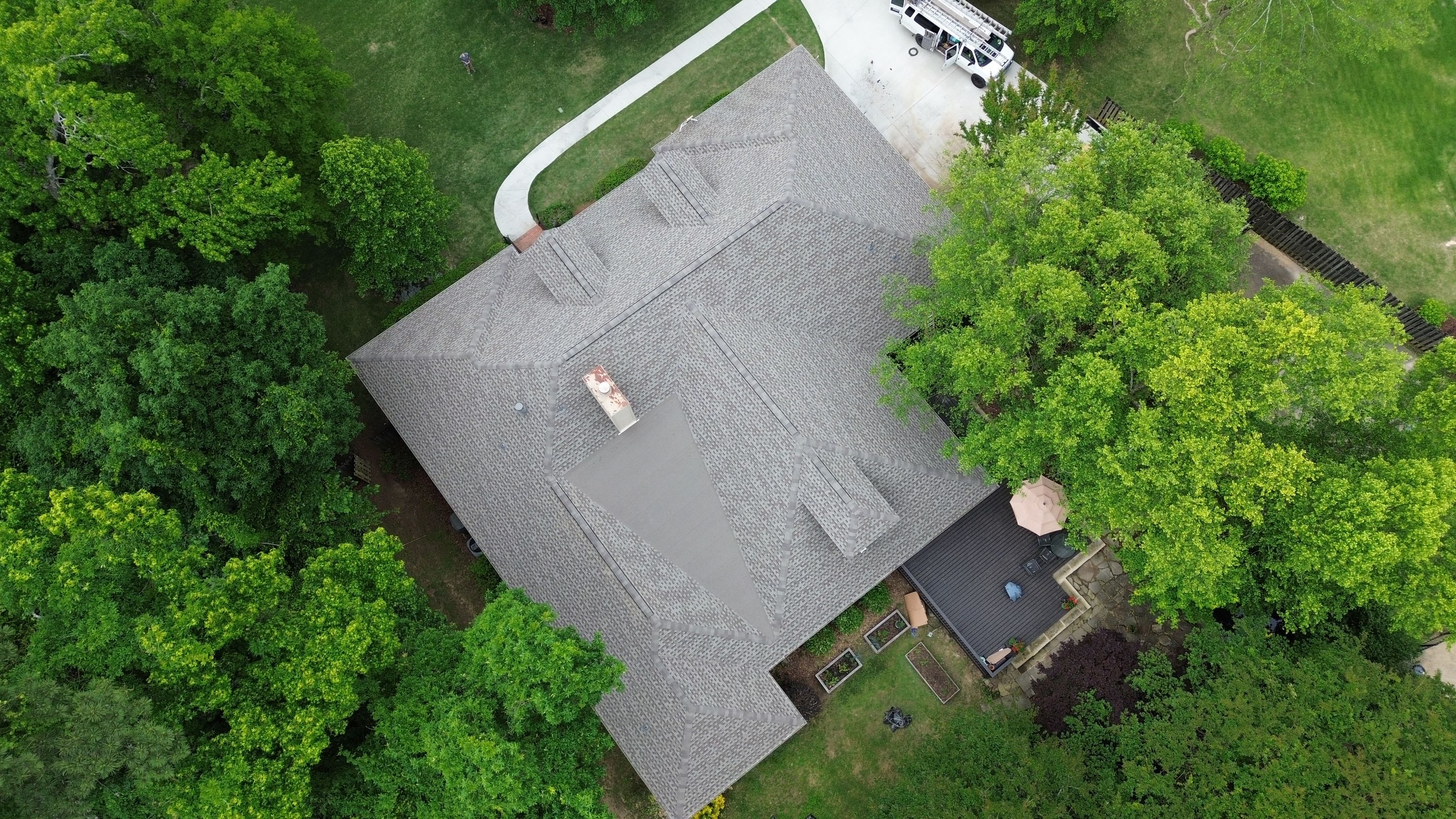 Aerial view of a gray shingle roof replacement recently completed on a home in the Carisbrooke neighborhood of Hoover.