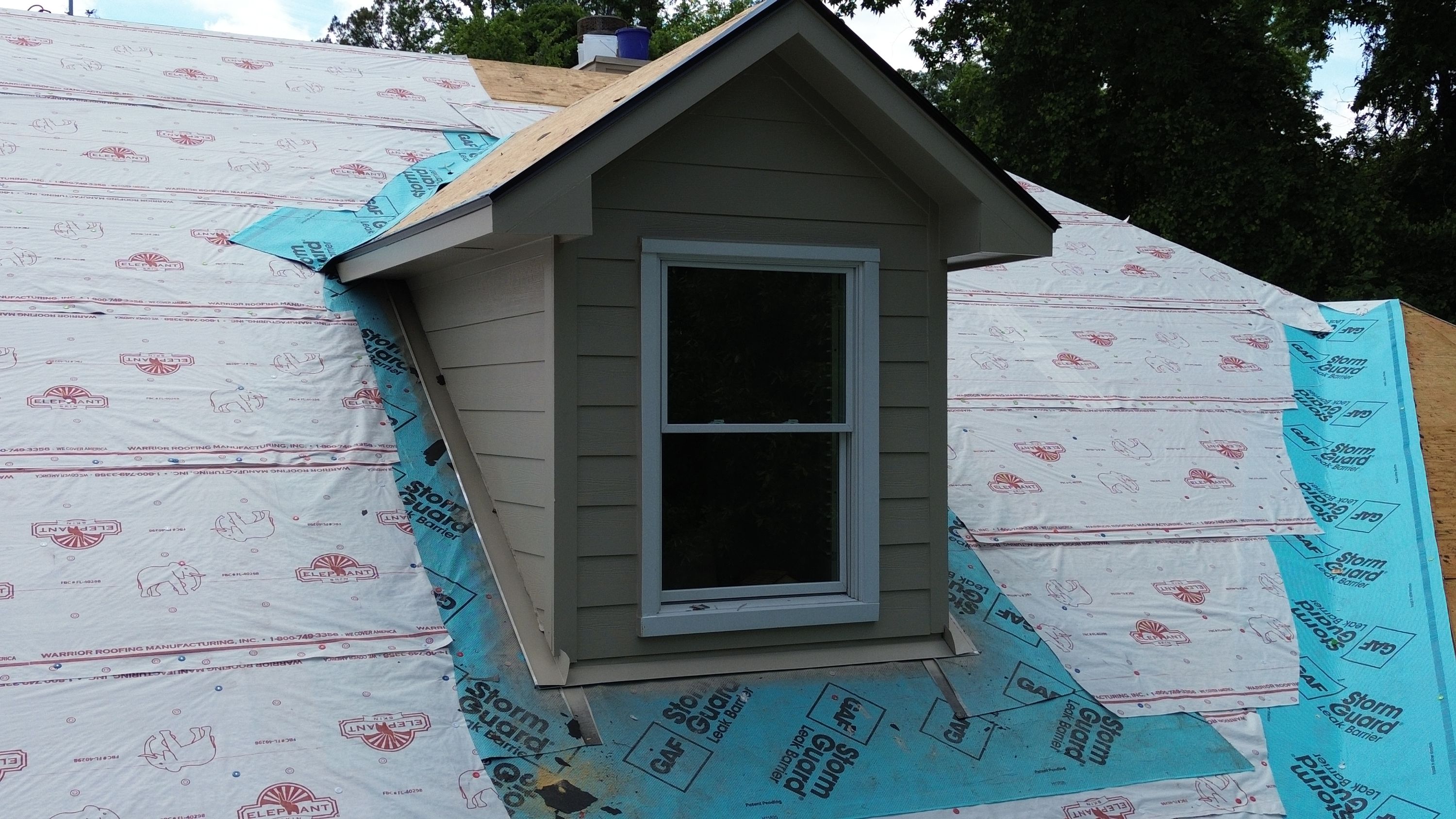 Roof underlayment and siding installation on a dormer window at a home in the Carisbrooke neighborhood of Hoover.