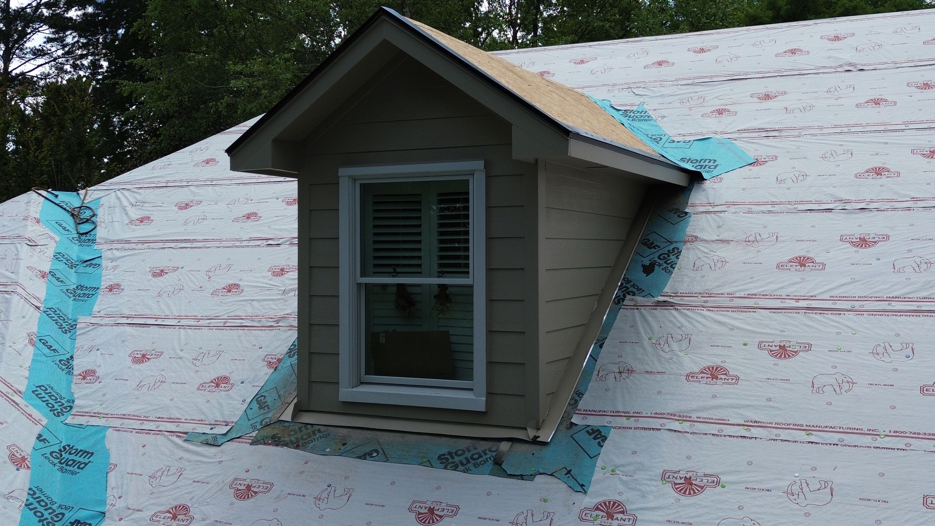 Roof underlayment and siding installation on a dormer window at a home in the Carisbrooke neighborhood of Hoover.