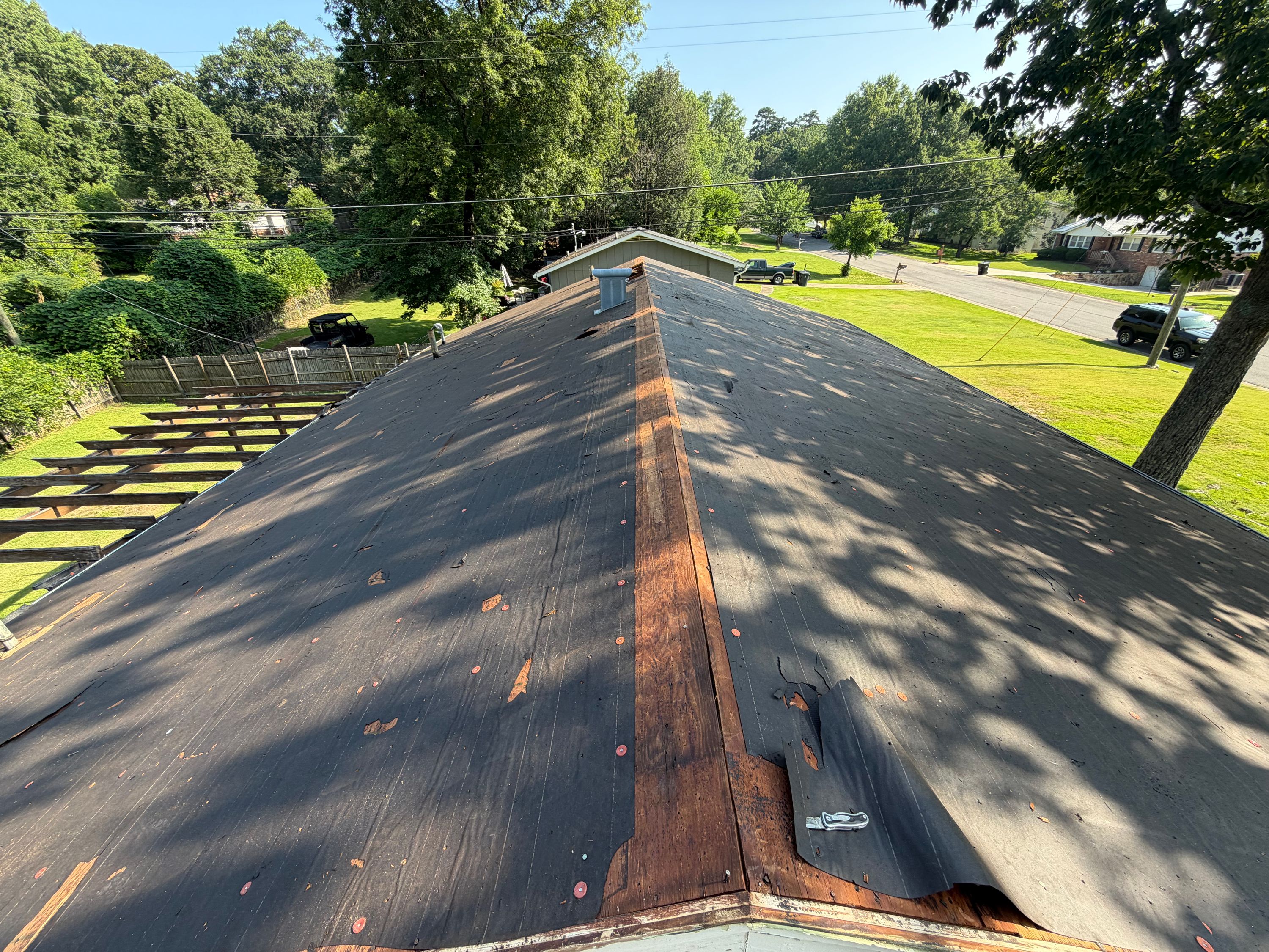 Looking down the newly lined ridge of a residential roof replacement project in Vestavia Hills.