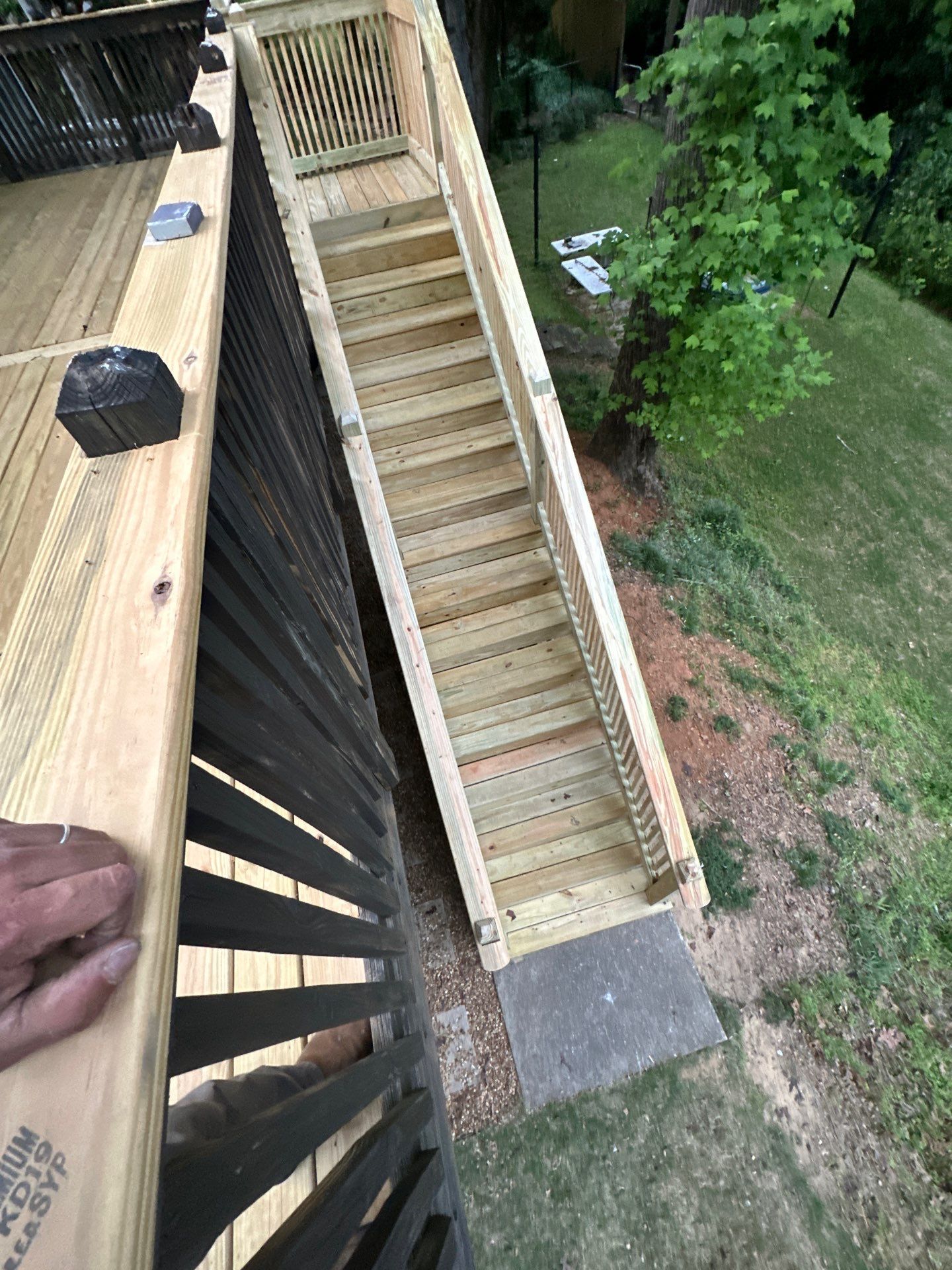 A newly constructed wooden staircase for a custom deck at a home in Vestavia Hills.