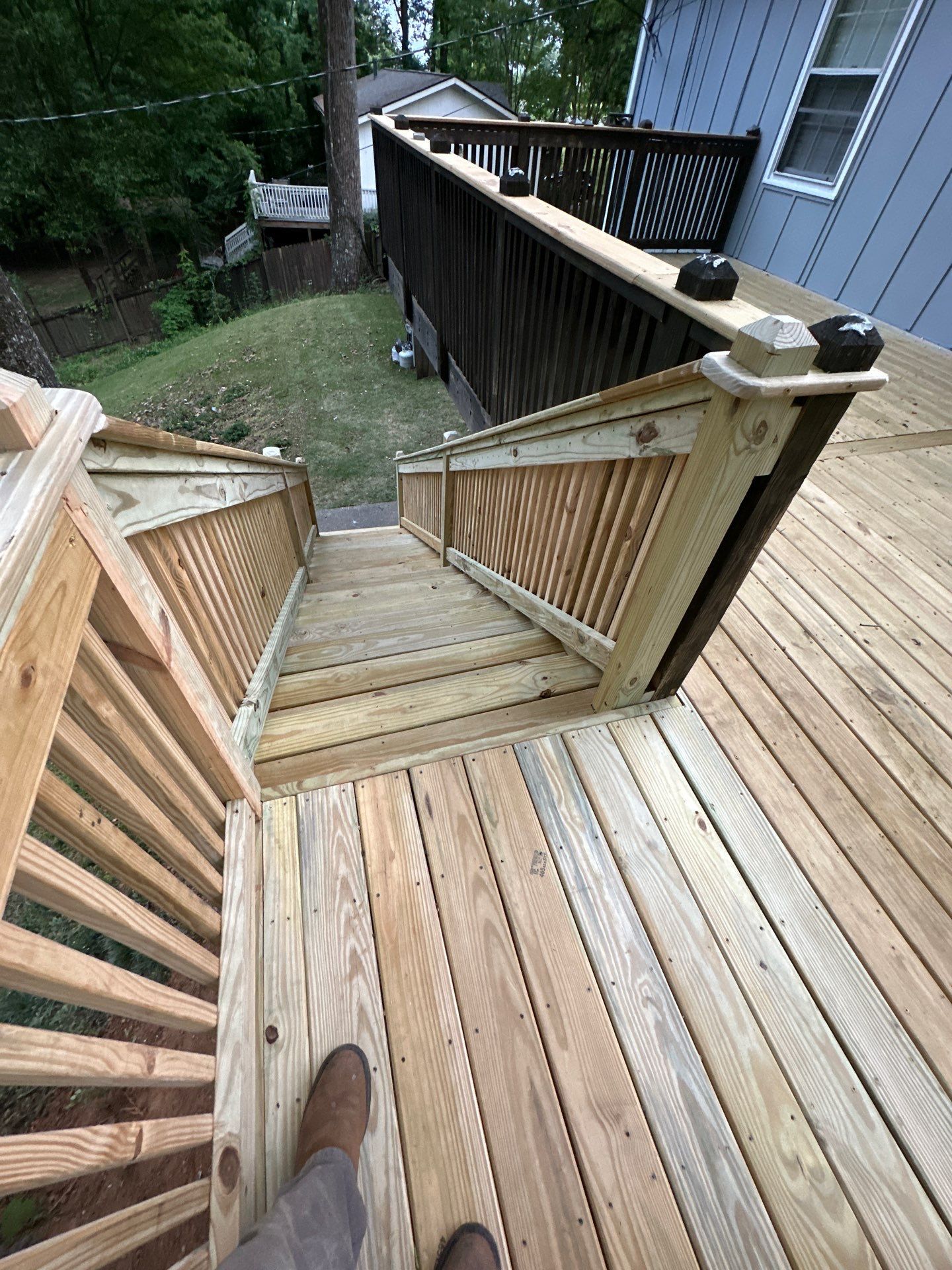 A newly constructed pressure-treated wood deck and staircase at a residence in Vestavia Hills.