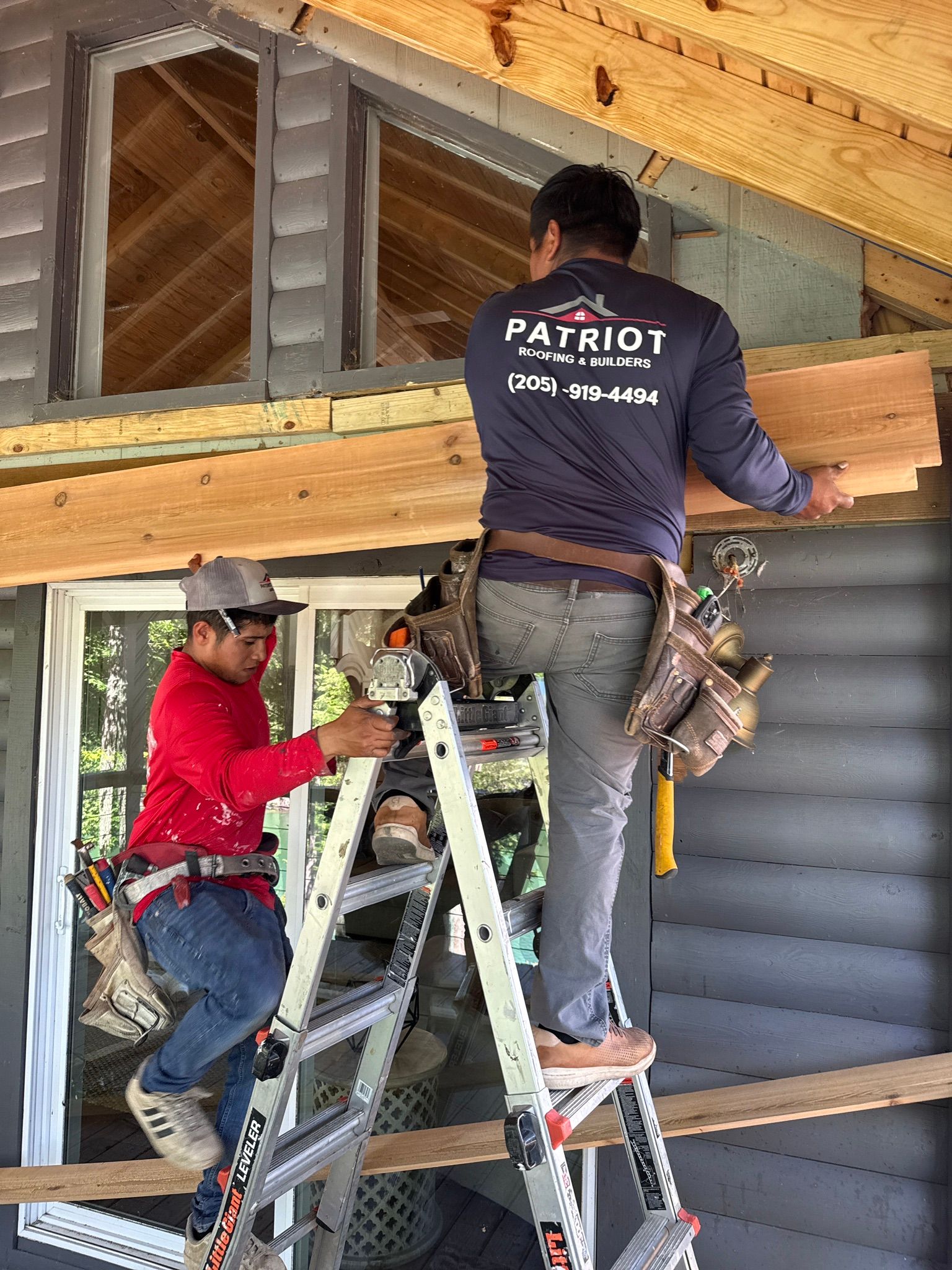 Installing new wood trim for a custom deck project on a home at Smith Lake in Jasper.