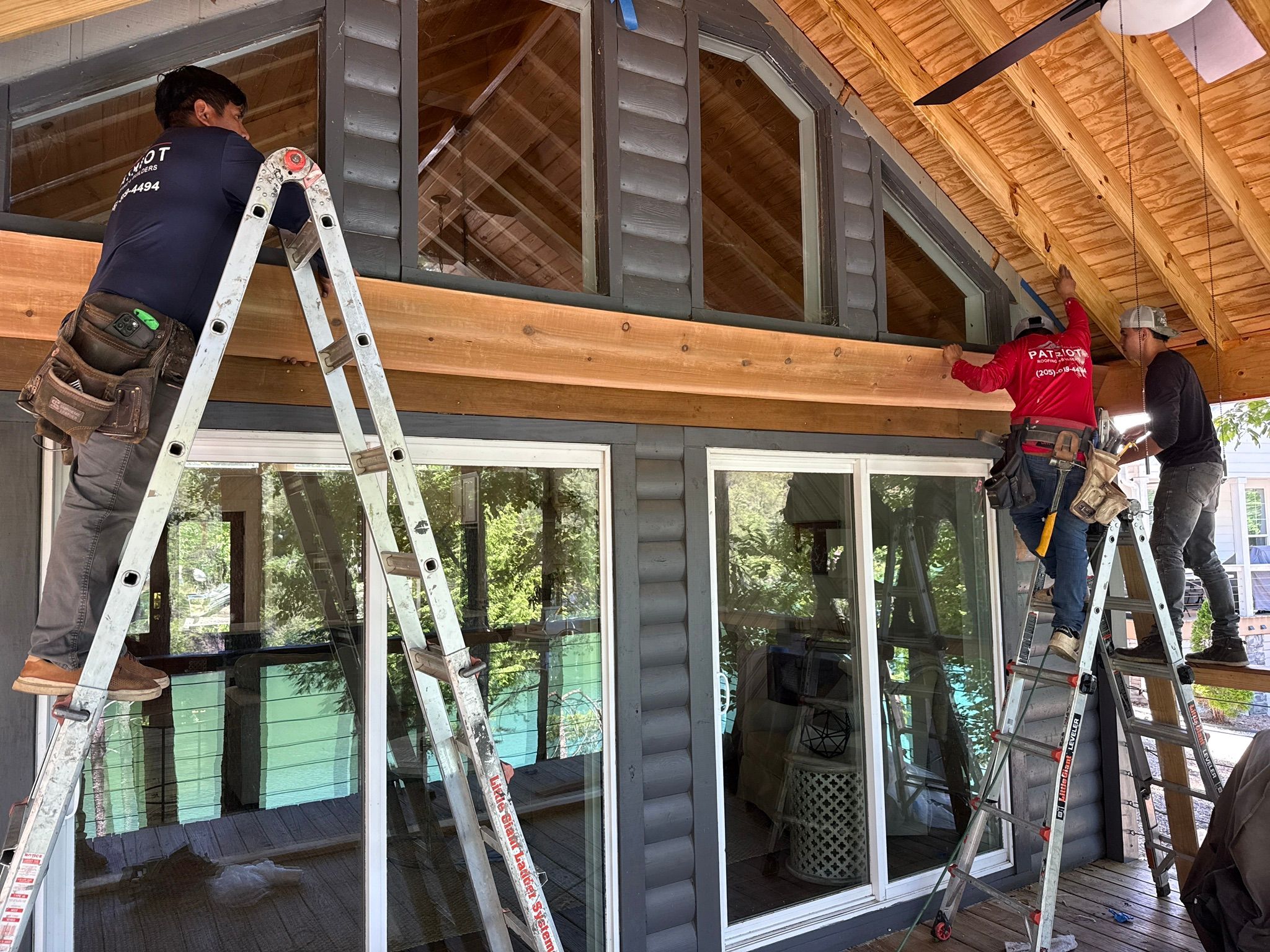 Installing cedar trim on a custom deck addition at a home on Smith Lake in Jasper.