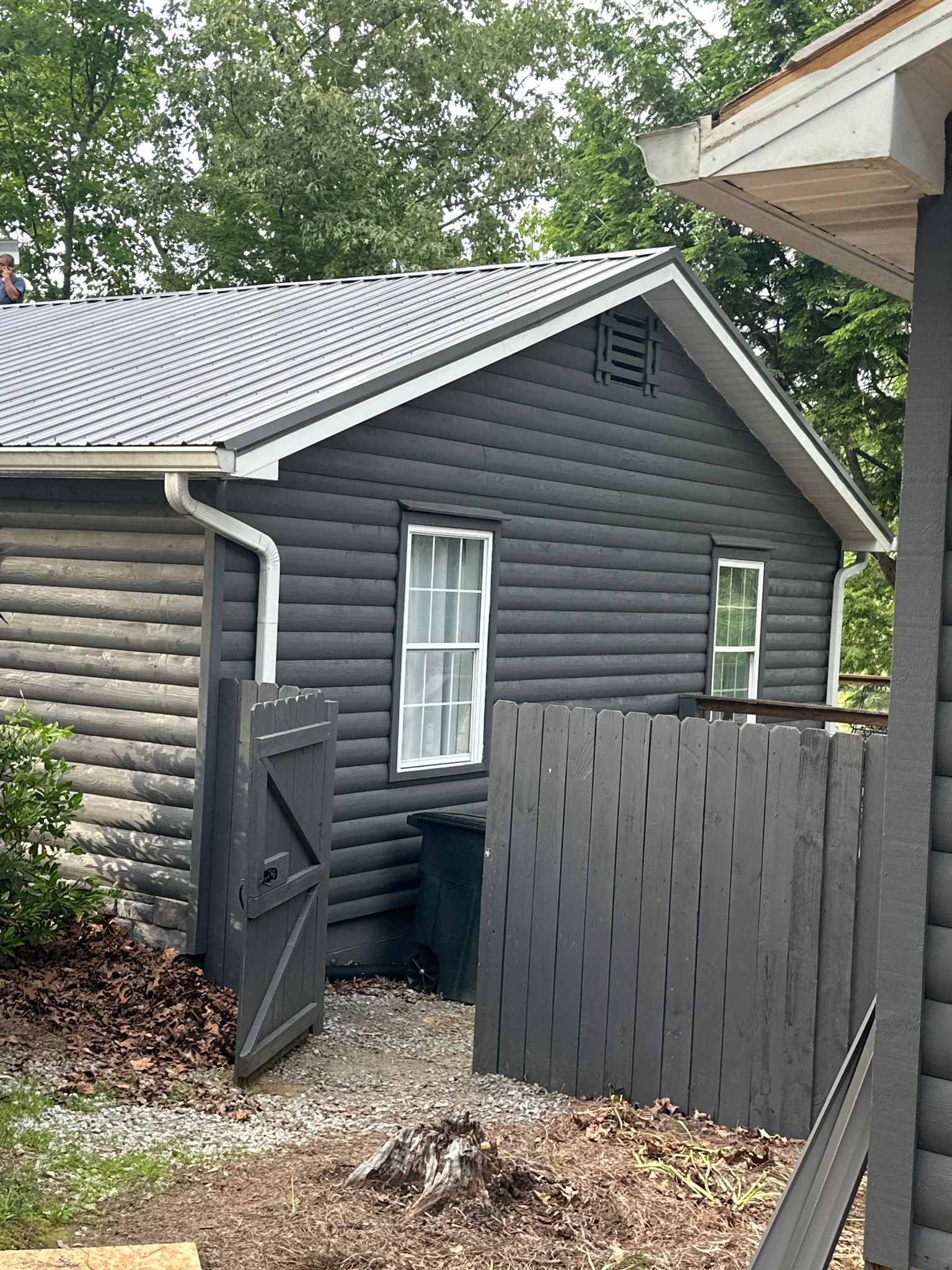 A new metal roof installed on a dark cabin near Smith Lake in Jasper.