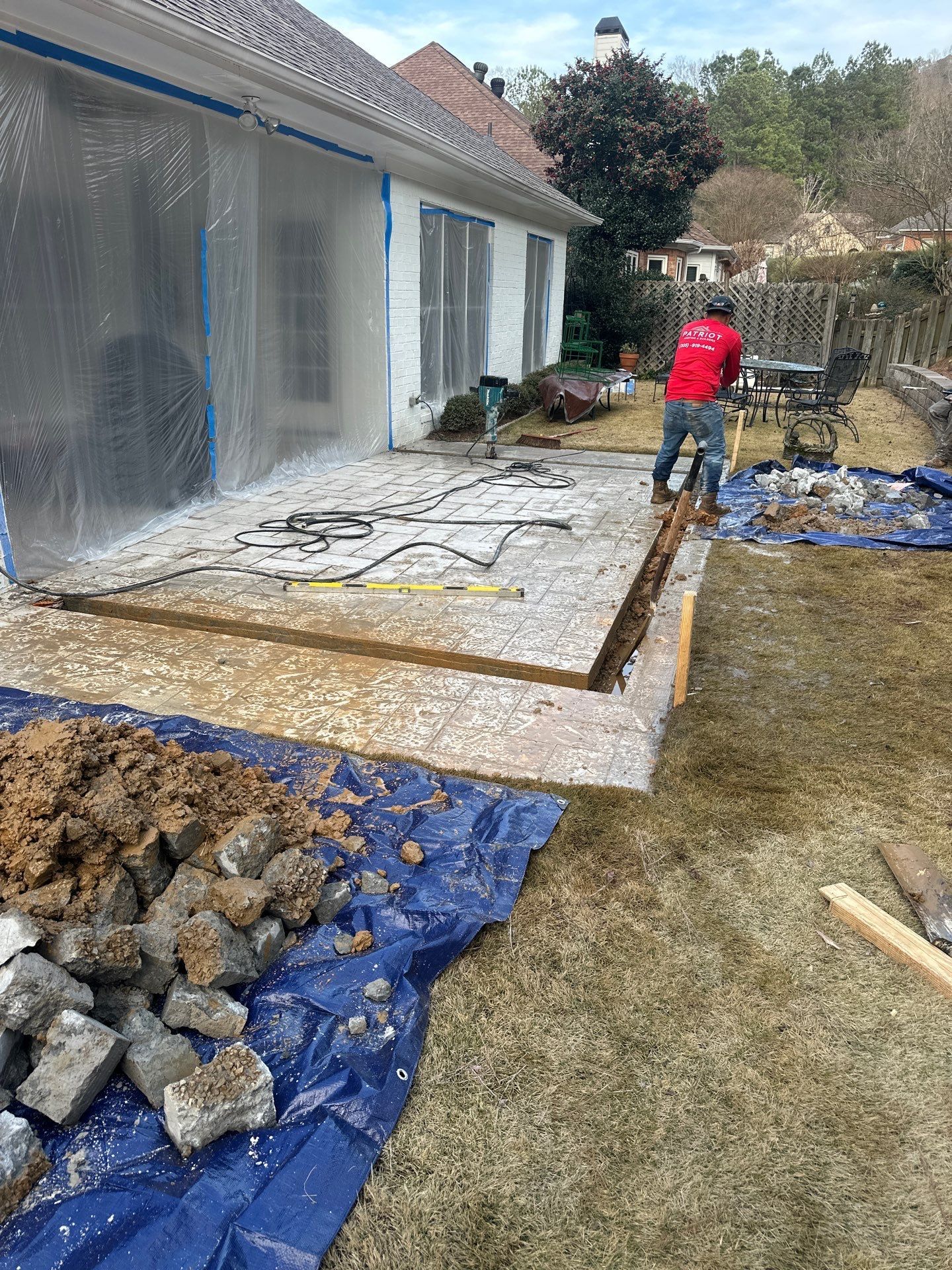 New roof replacement and gutter installation on a white brick home in Greystone, Hoover.