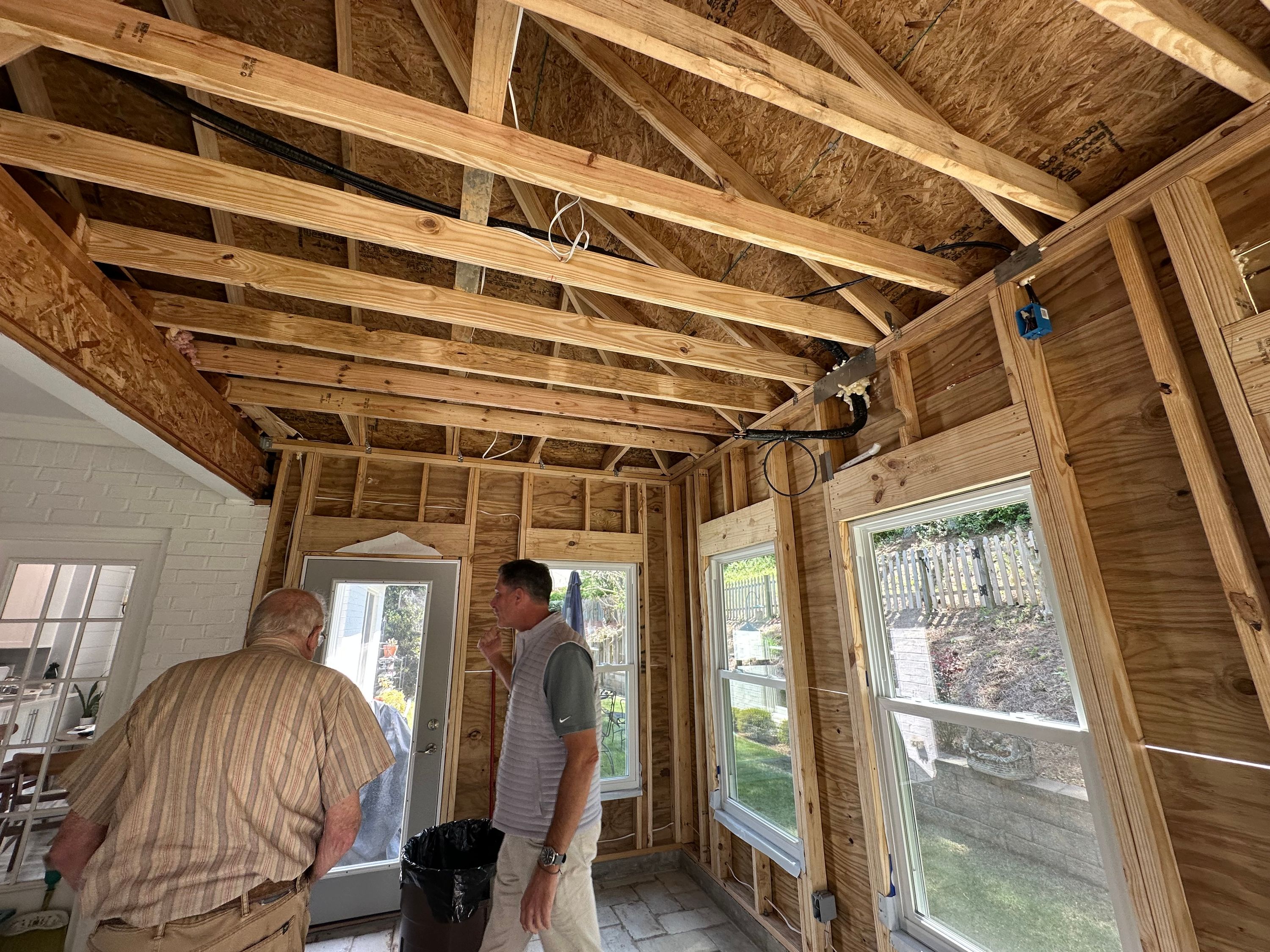 Exposed wood framing and roof rafters during a renovation in a Greystone home in Hoover.