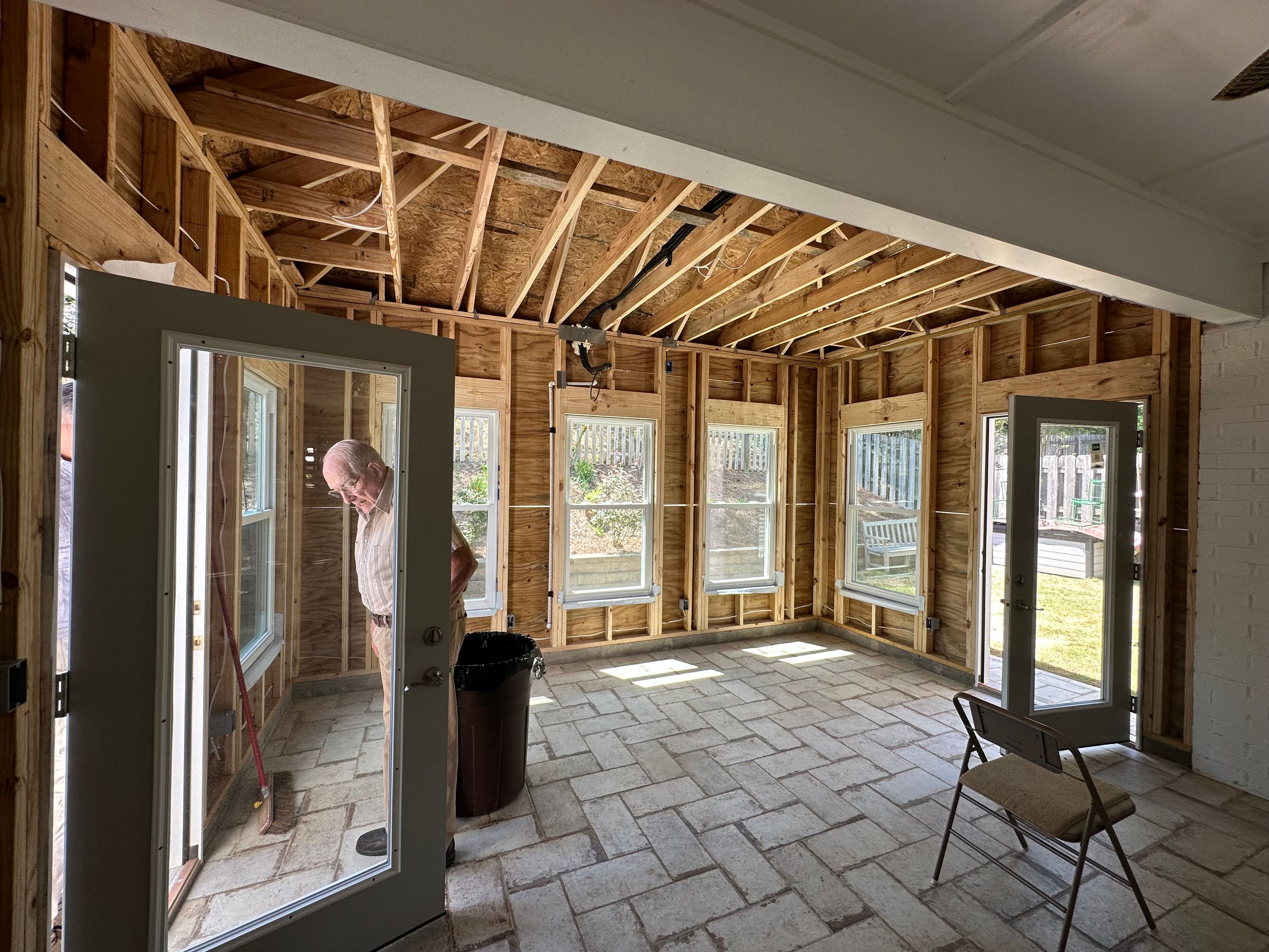 Exposed wood framing and new windows installed during a home addition project in the Greystone neighborhood of Hoover.