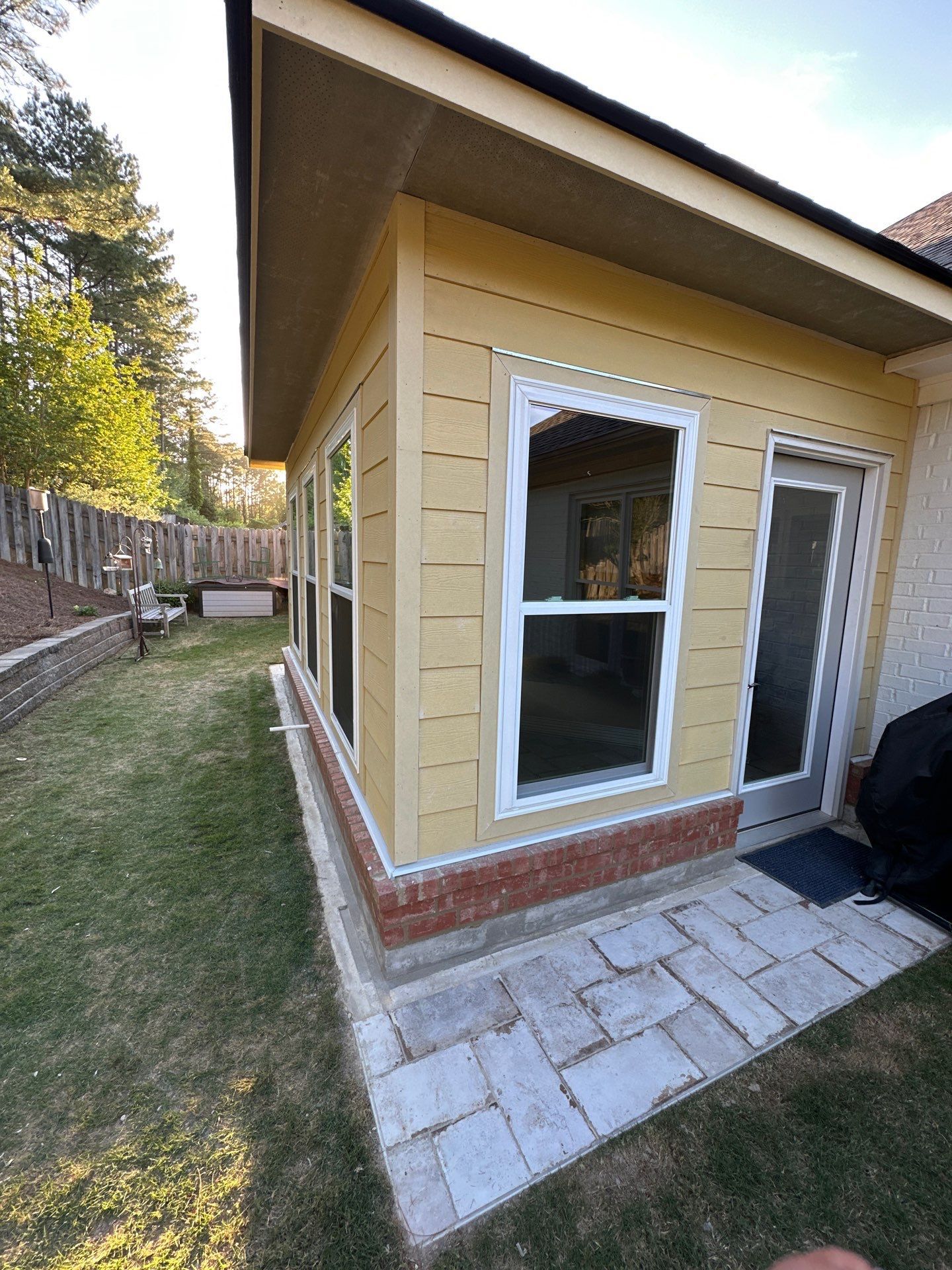 Yellow siding and windows installed on a home addition in the Greystone neighborhood of Hoover.