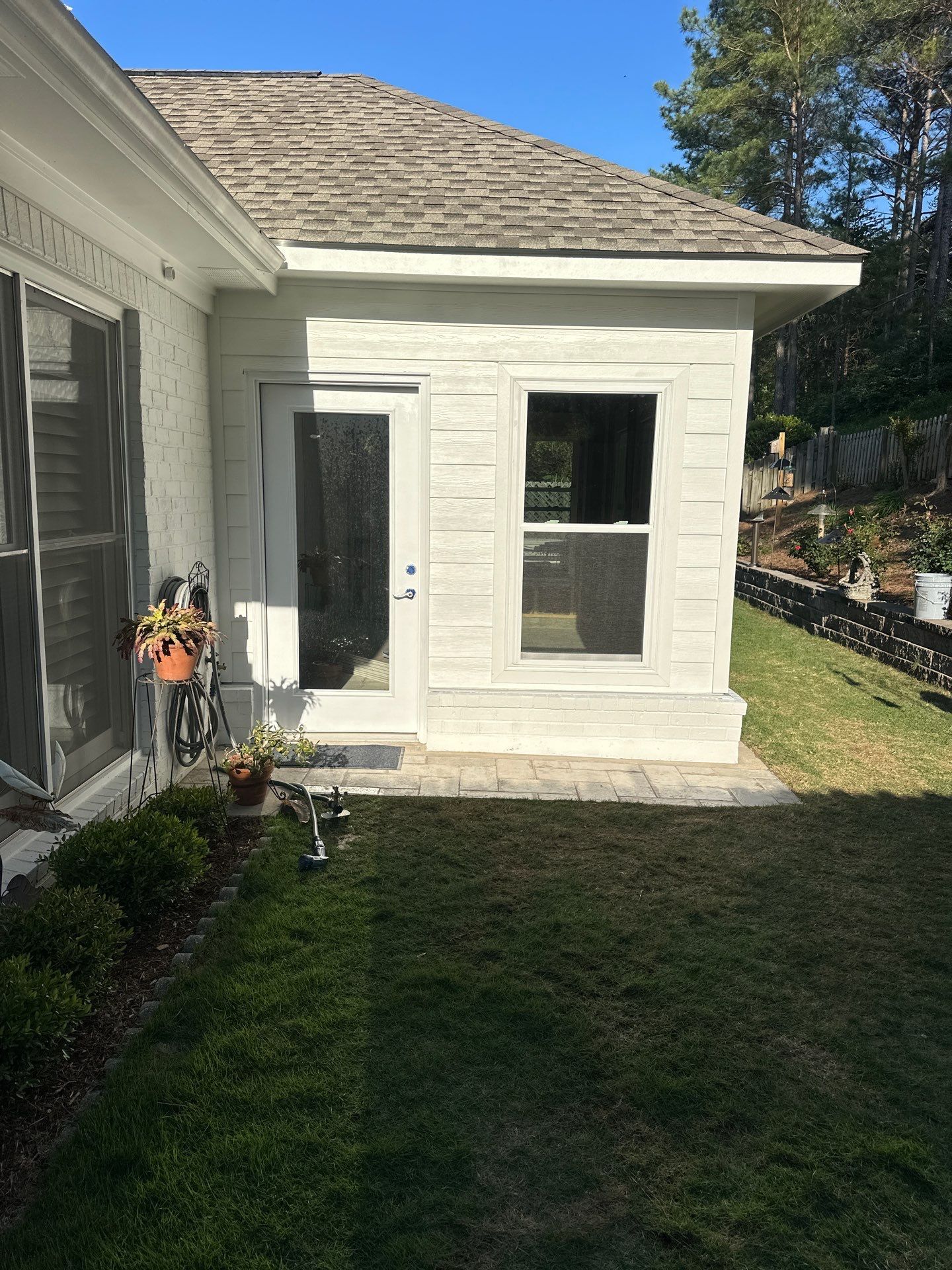 White lap siding installation on a home addition in the Greystone neighborhood of Hoover.