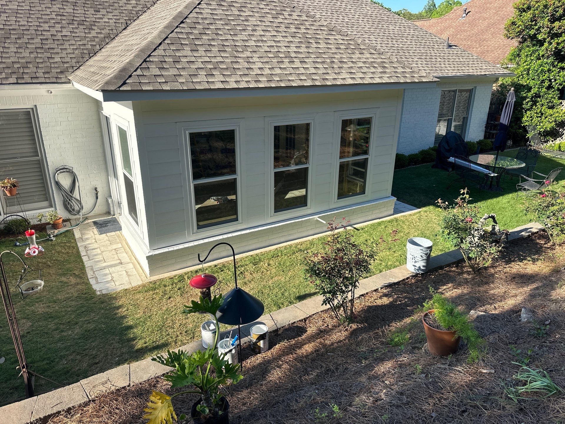 Newly installed white siding and windows on a home addition in the Greystone neighborhood of Hoover.