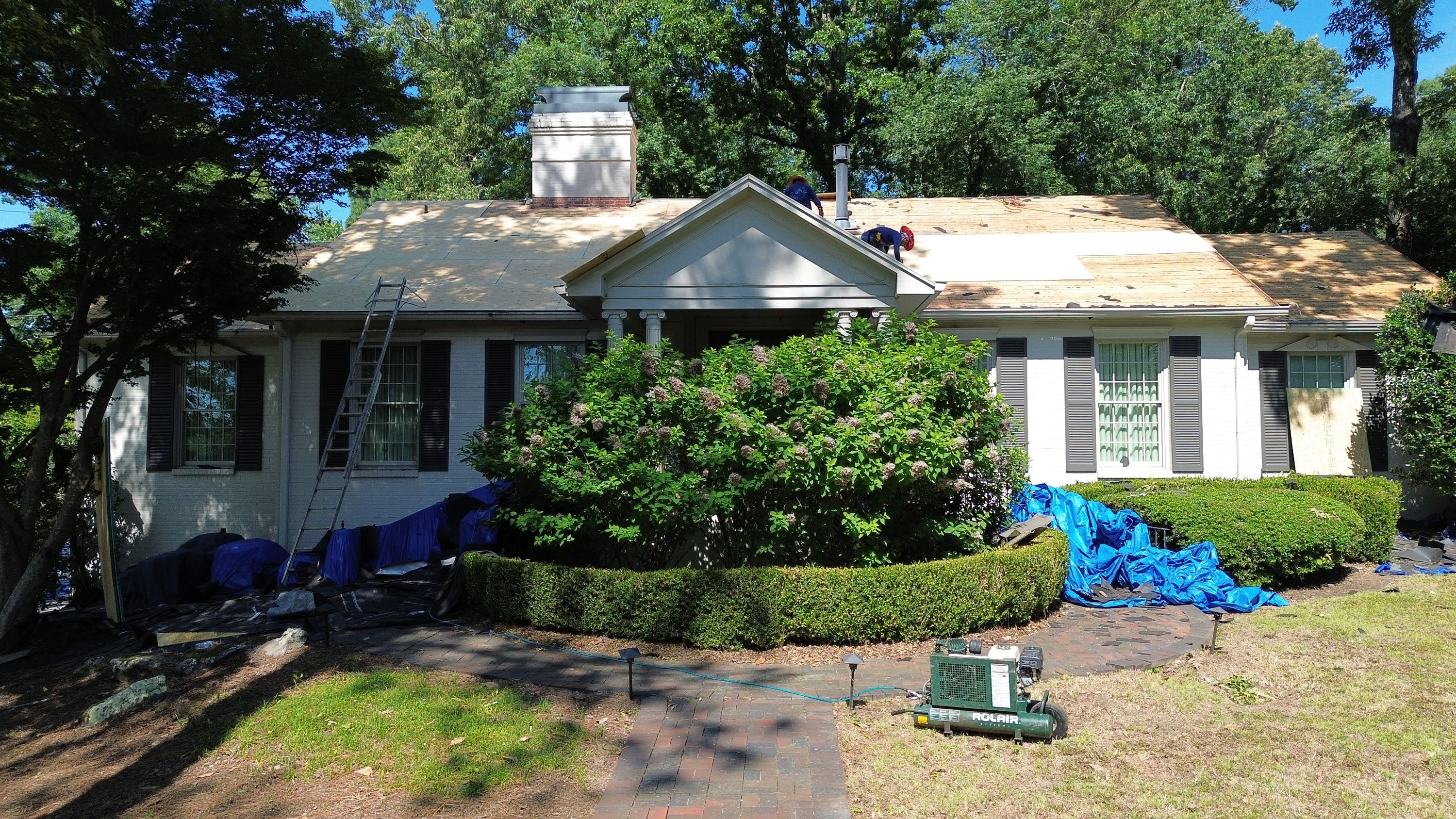 Exposed plywood decking during a residential roof replacement project on a home in Mountain Brook.