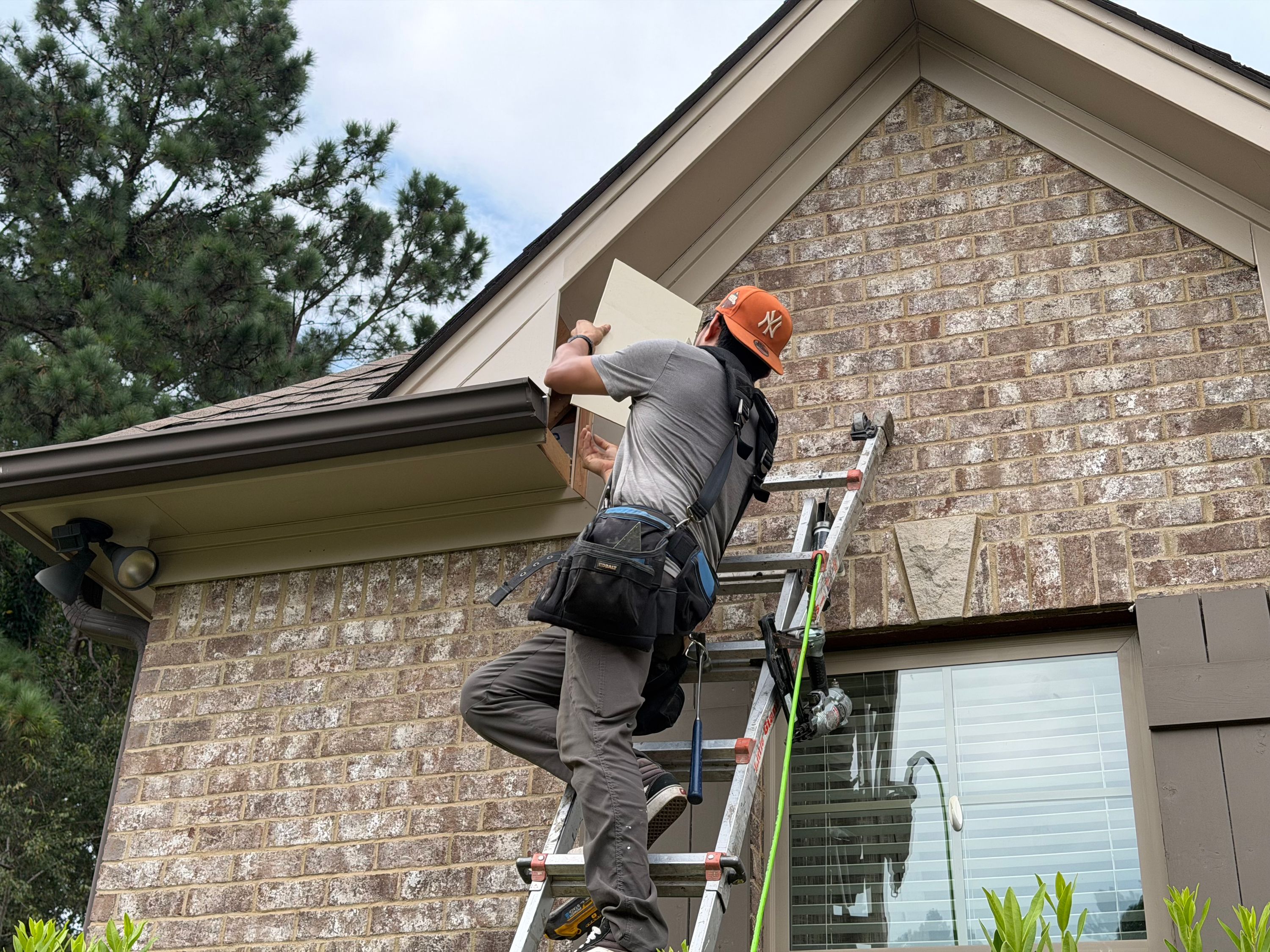 Fascia board installation secures the roofline trim during a Chelsea roof repair project.
