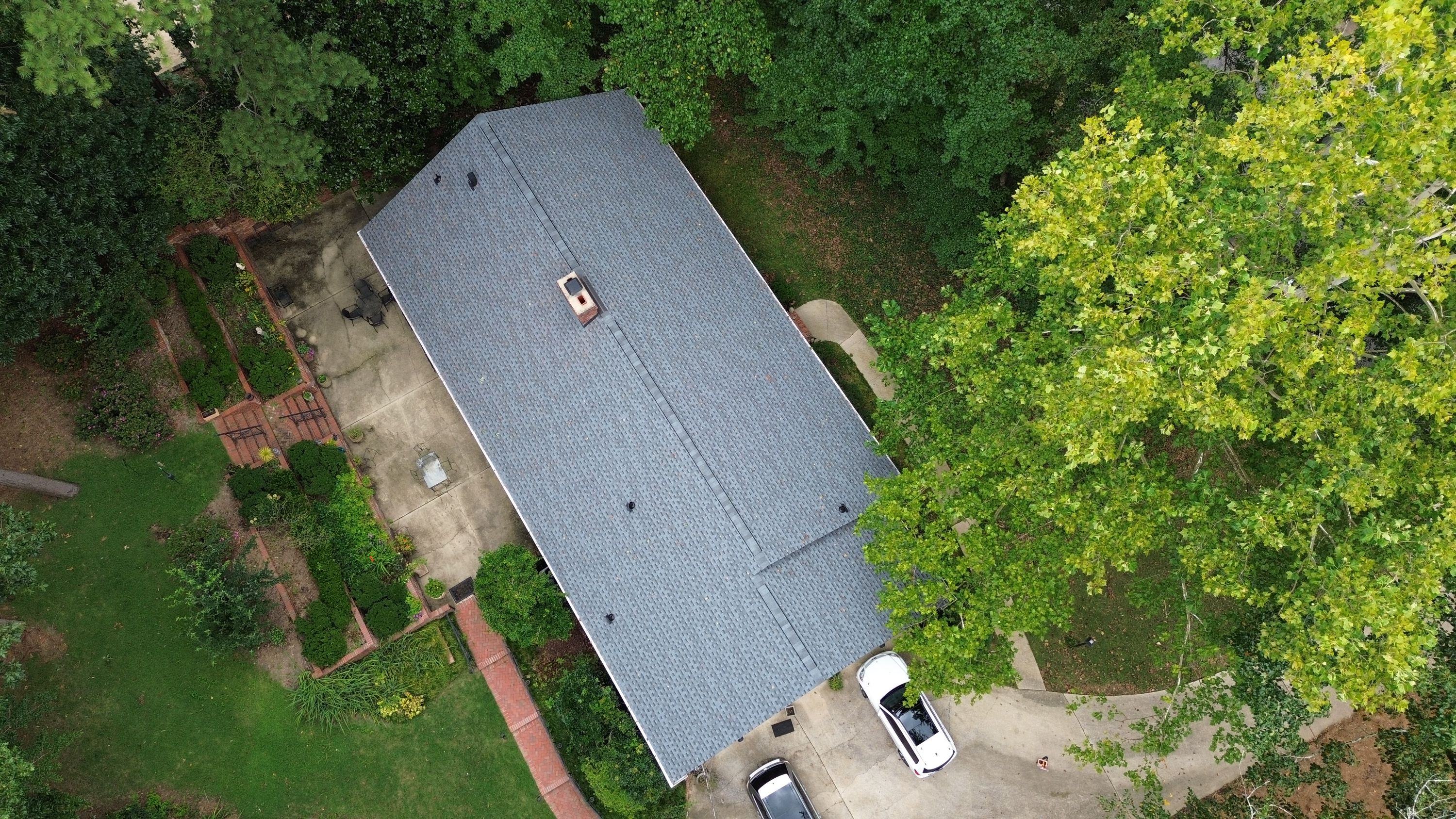 Aerial view of a complete roof replacement featuring clean ridge lines on a home in Cherokee Bend, Mountain Brook.